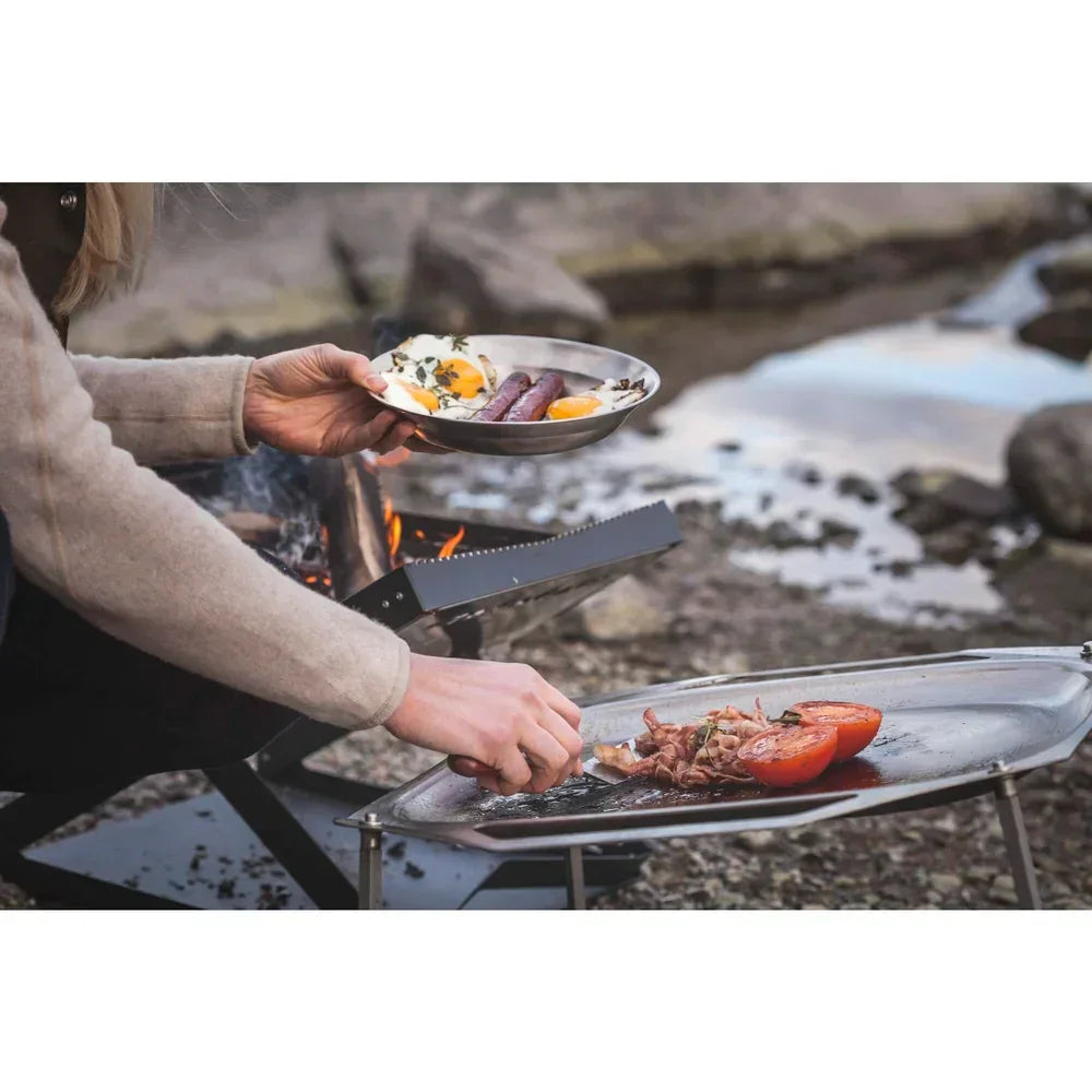 Fire pit with open fire fuel burning for warmth and outdoor gathering
