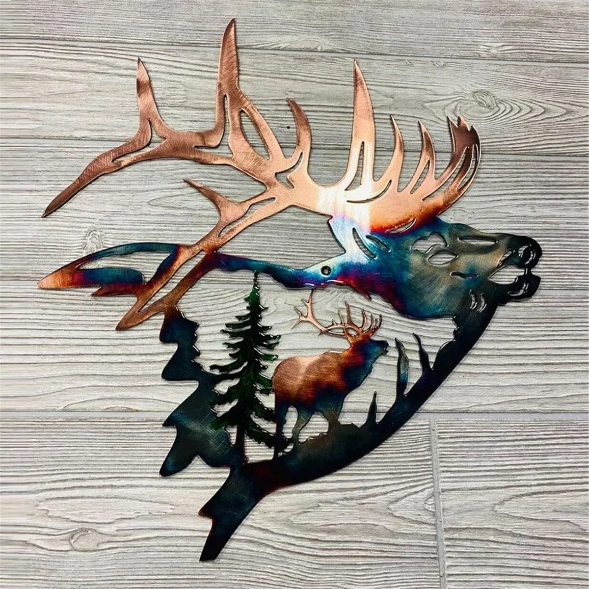 Metal wall art of elk head with antlers, forest scene, pine trees on wood background