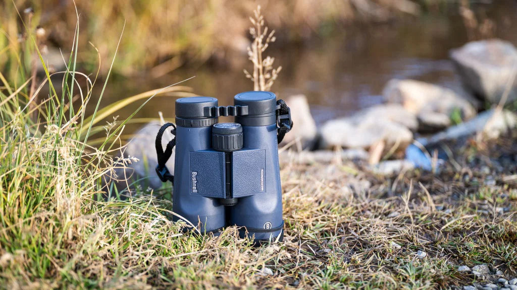 Bushnell binoculars, laser rangefinder, and spotting scope used for hunting and outdoor observation