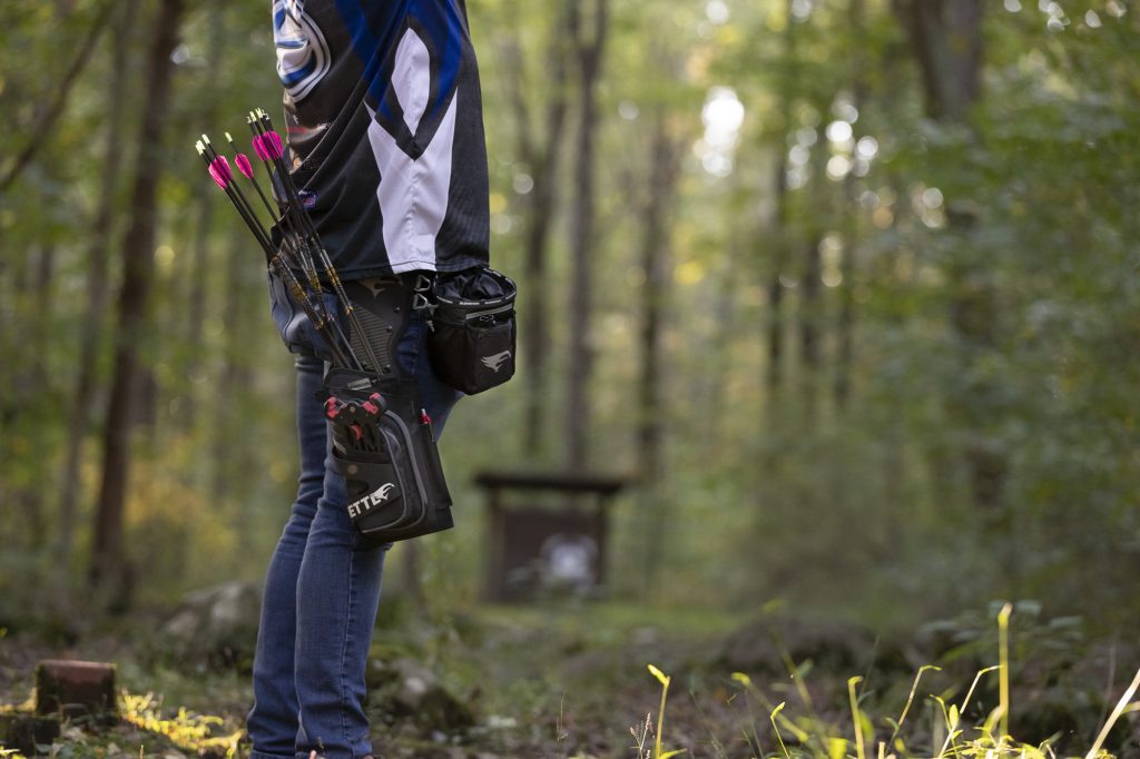 Hip quiver on archer for easy arrow access during shooting