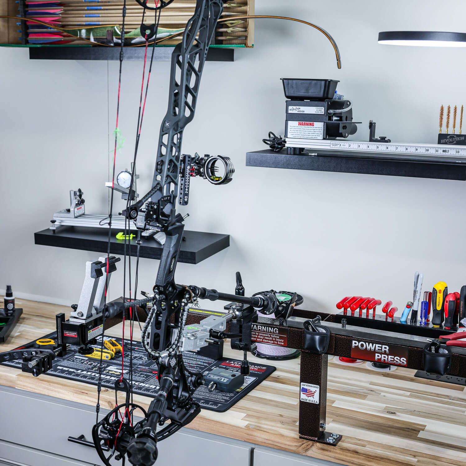 Bow vise holding a compound bow during setup or repair
