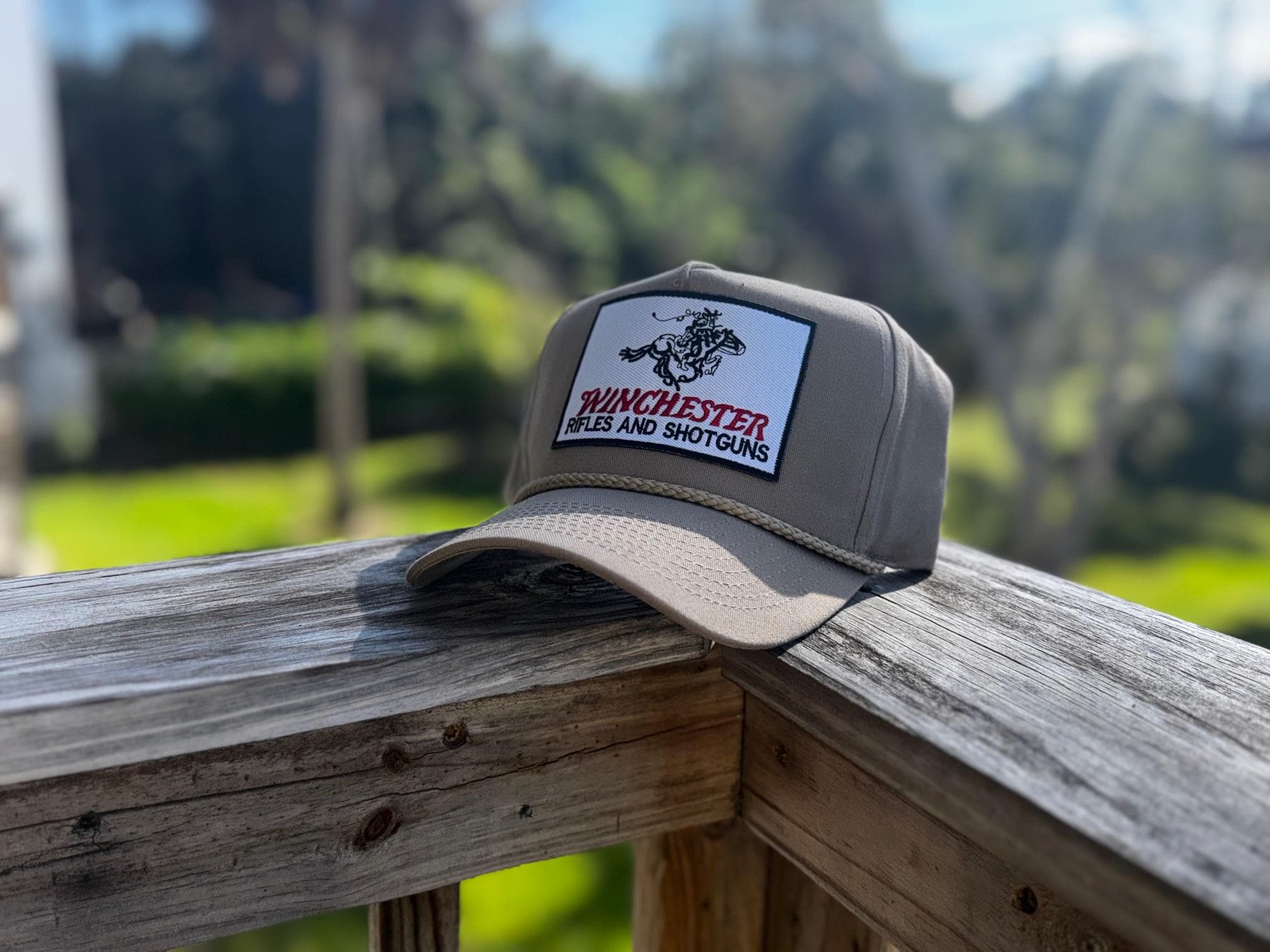 Winchester branded hunting caps and trucker hats with embroidered Winchester logos for hunters and outdoor enthusiasts