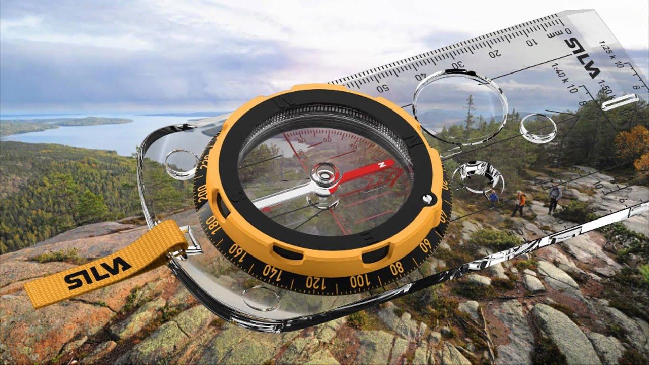 Silva liquid-filled compass on a topographic map during backcountry navigation