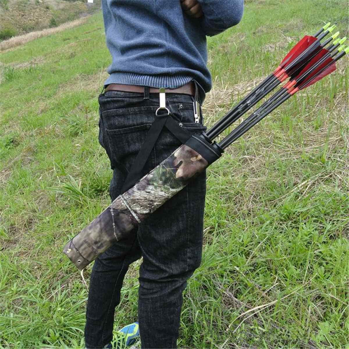 Person outdoors wearing camo archery quiver with arrows in a grassy field