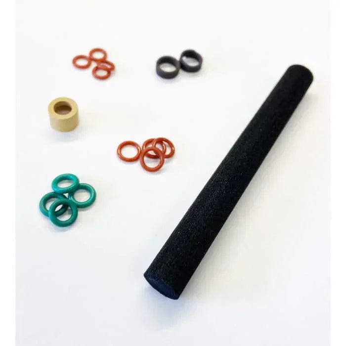Air compressor maintenance kit with O-rings, filter, and seals on white background.