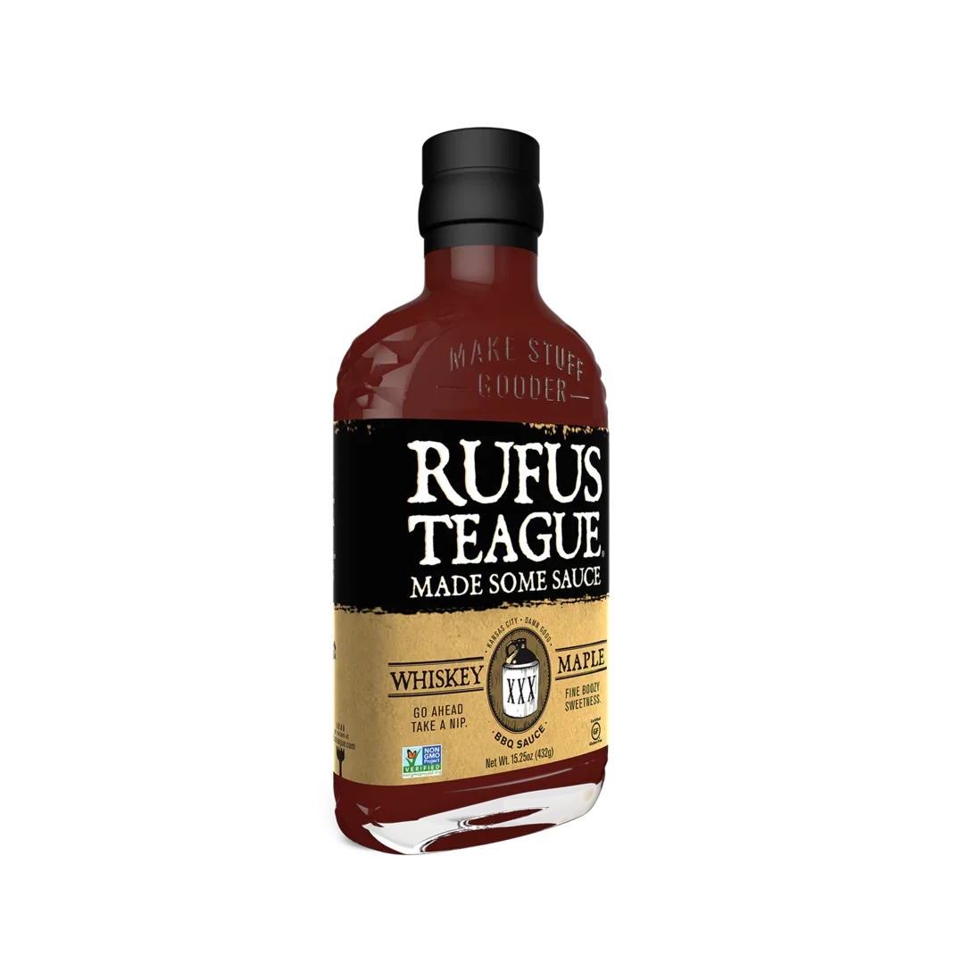Rufus Teague whiskey maple BBQ sauce bottle with black and gold label, isolated on white