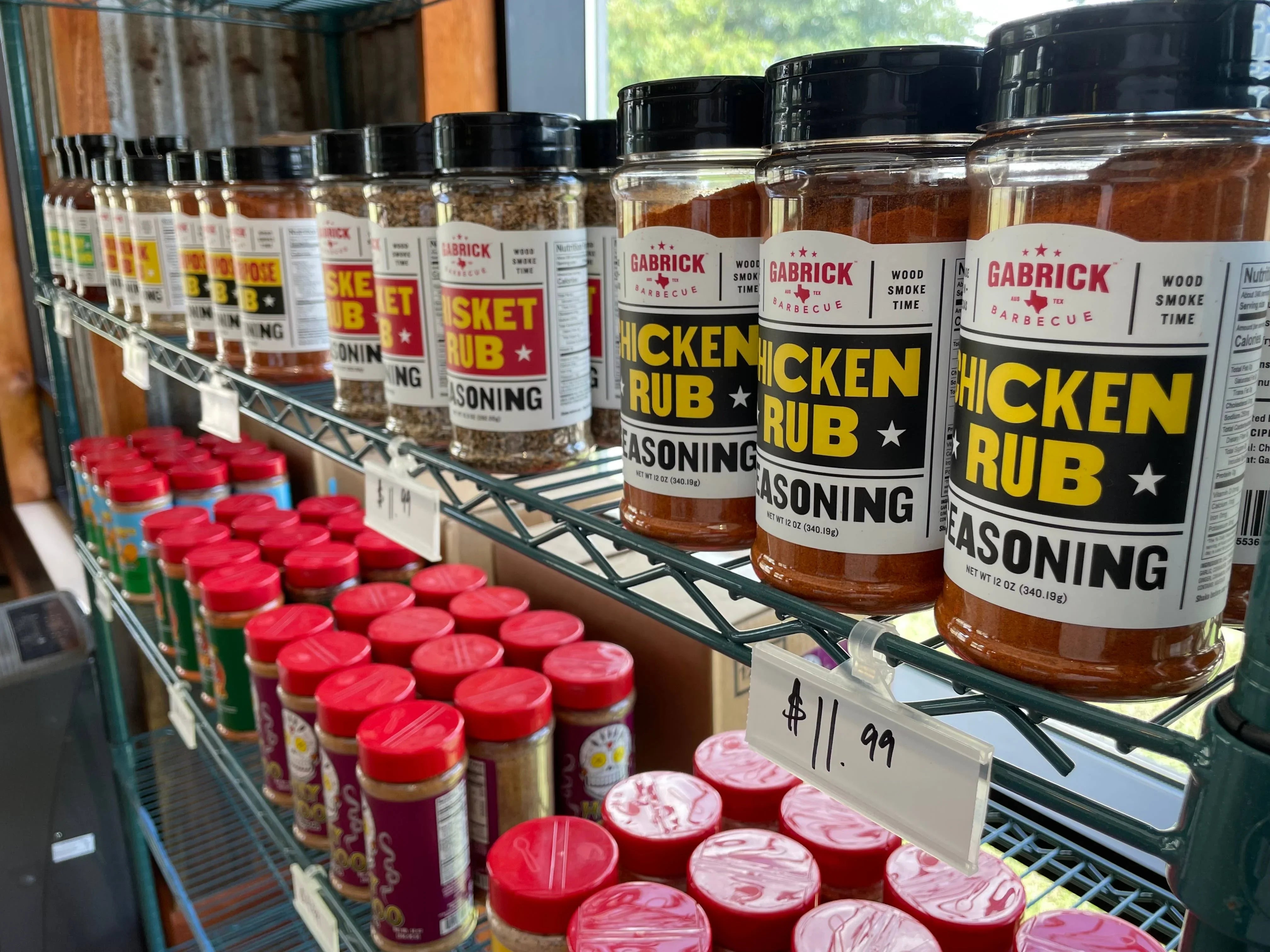 Jars of Gabrick Barbecue chicken rub seasoning and brisket rub on store shelf
