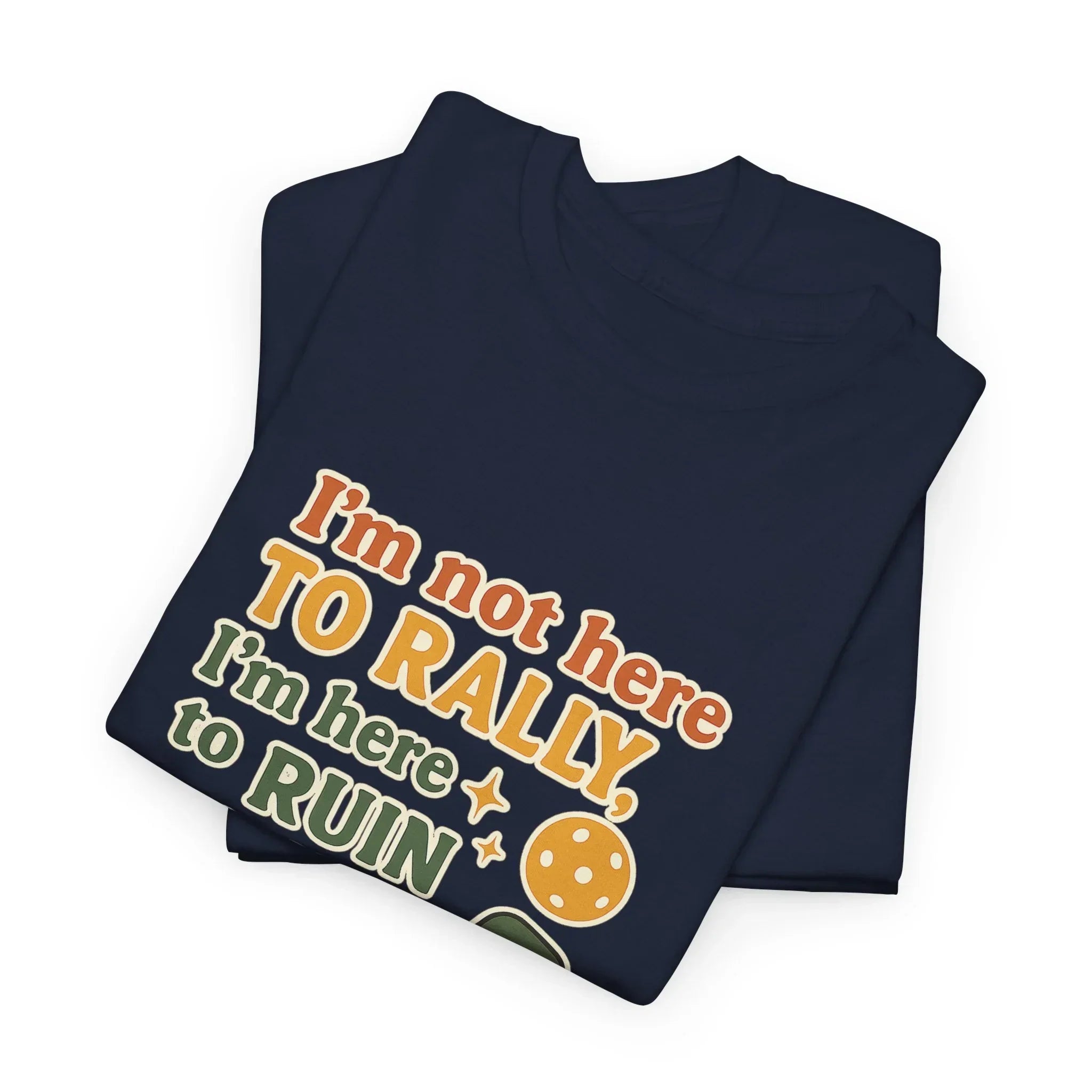 Folded navy t-shirt with funny pickleball slogan and illustrated pickleball graphic