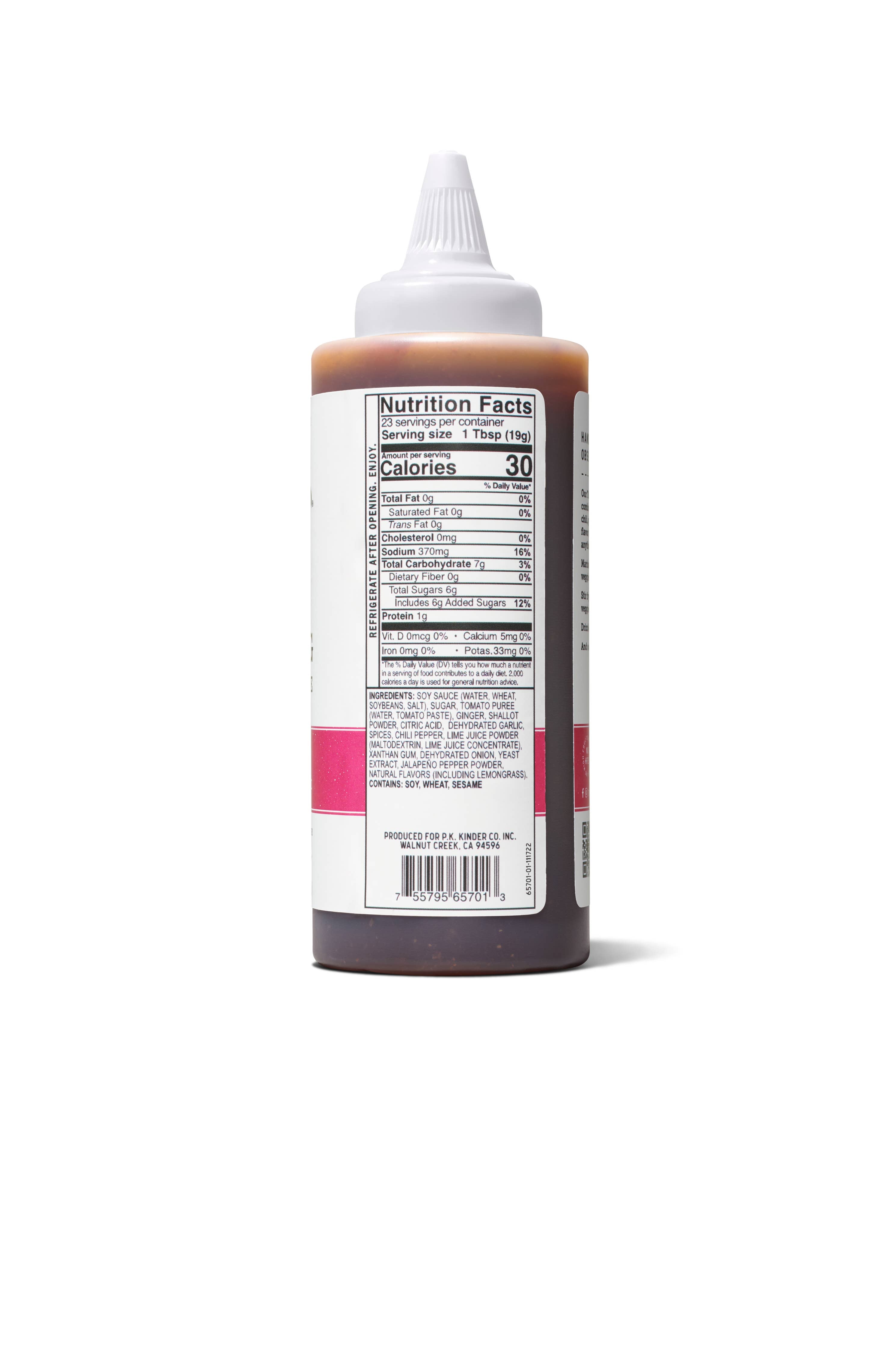 Squeeze bottle of sauce with nutrition facts label and ingredients list, white background
