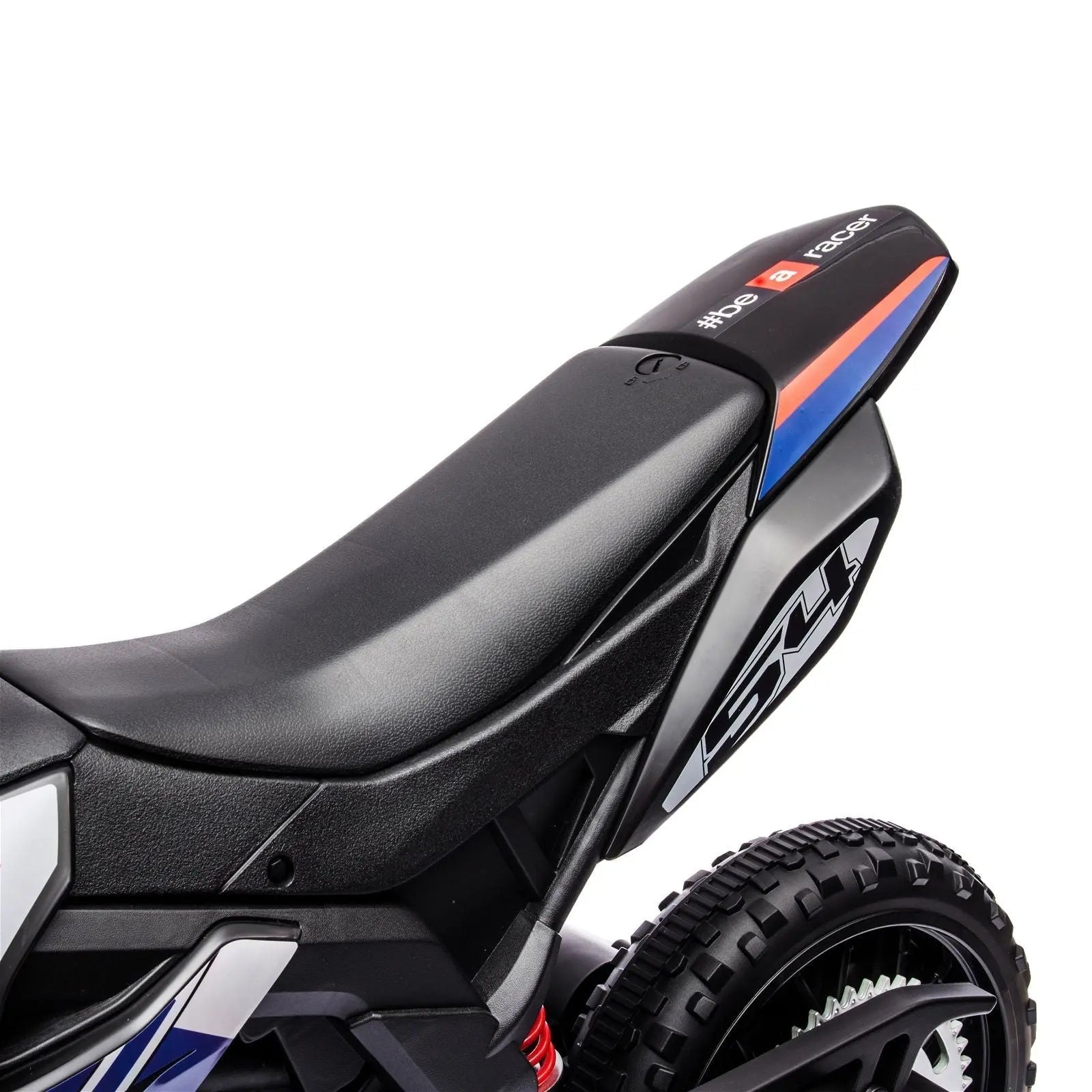 Close-up of black kids' ride-on motorcycle seat with racing decals and textured tire