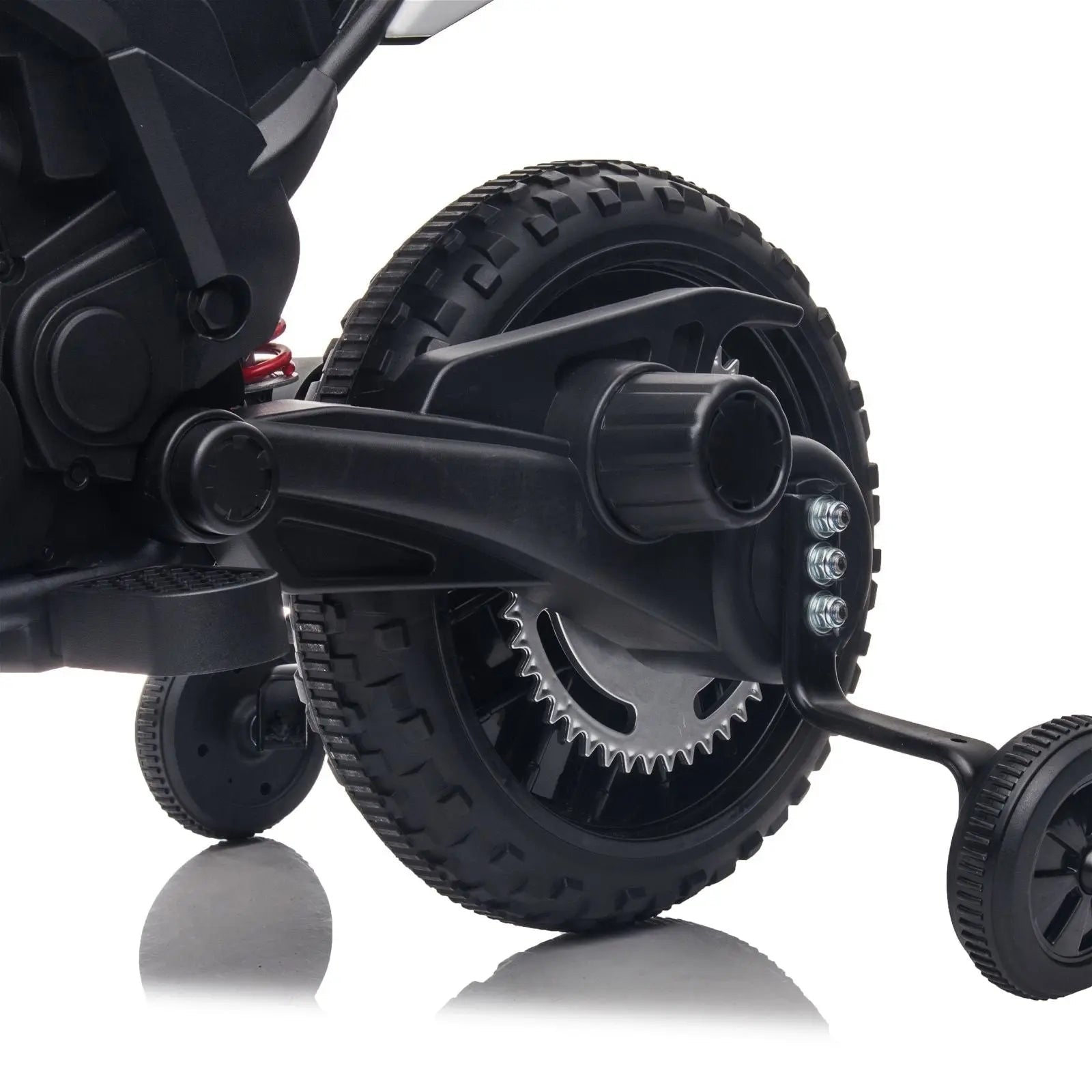 Close-up of ride-on toy motorcycle rear wheel with training wheels, black and rugged design