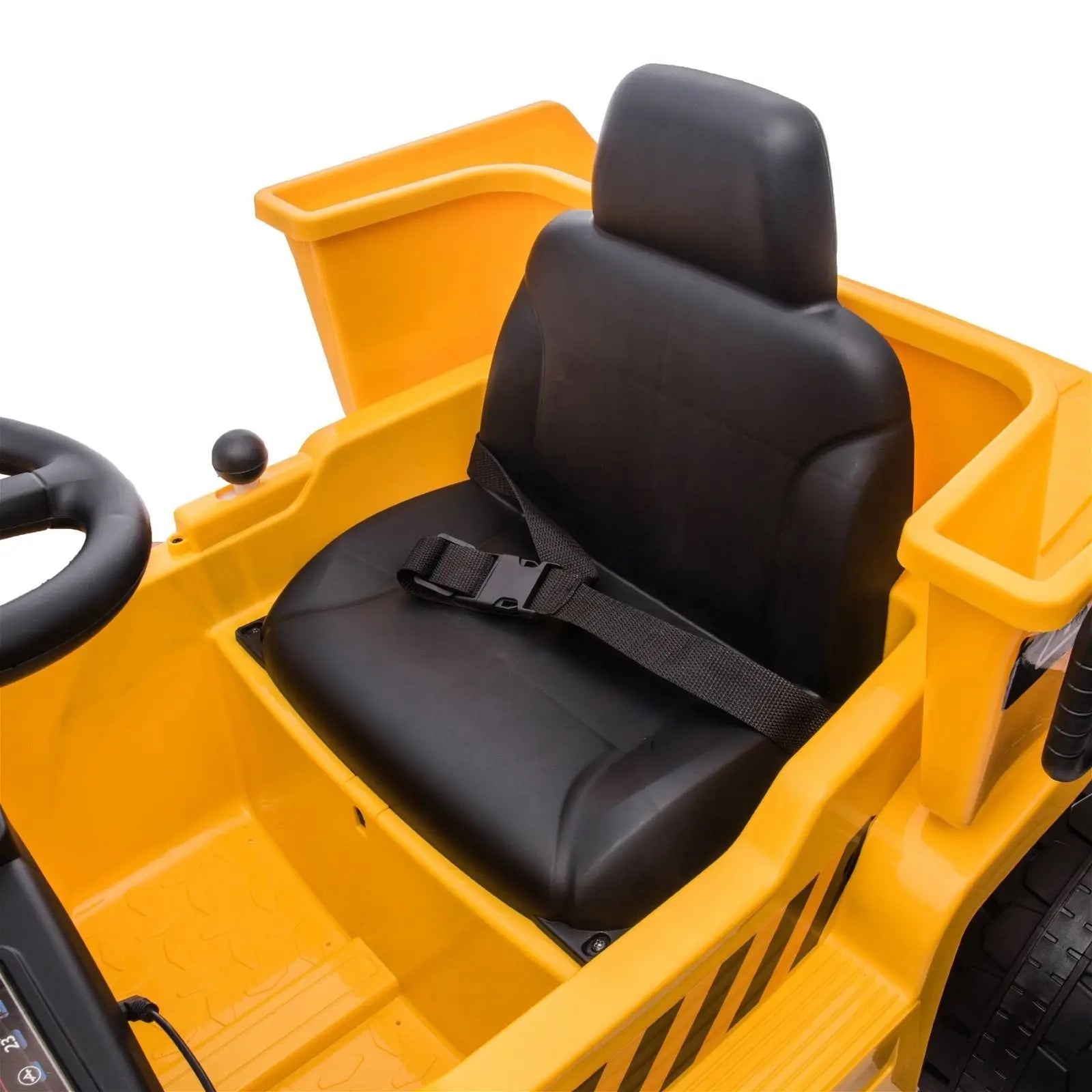 Close-up of yellow ride-on dump truck seat with black safety belt and steering wheel