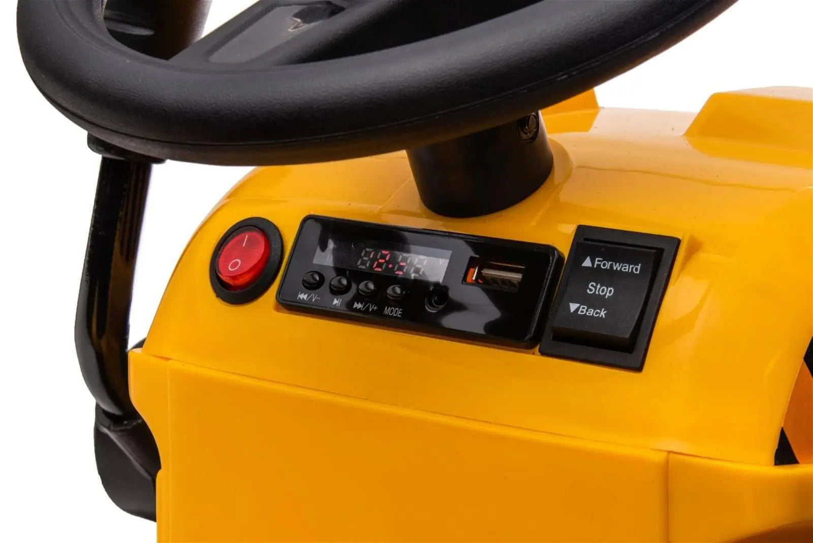 Close-up of yellow kids ride-on excavator dashboard with steering wheel and control buttons