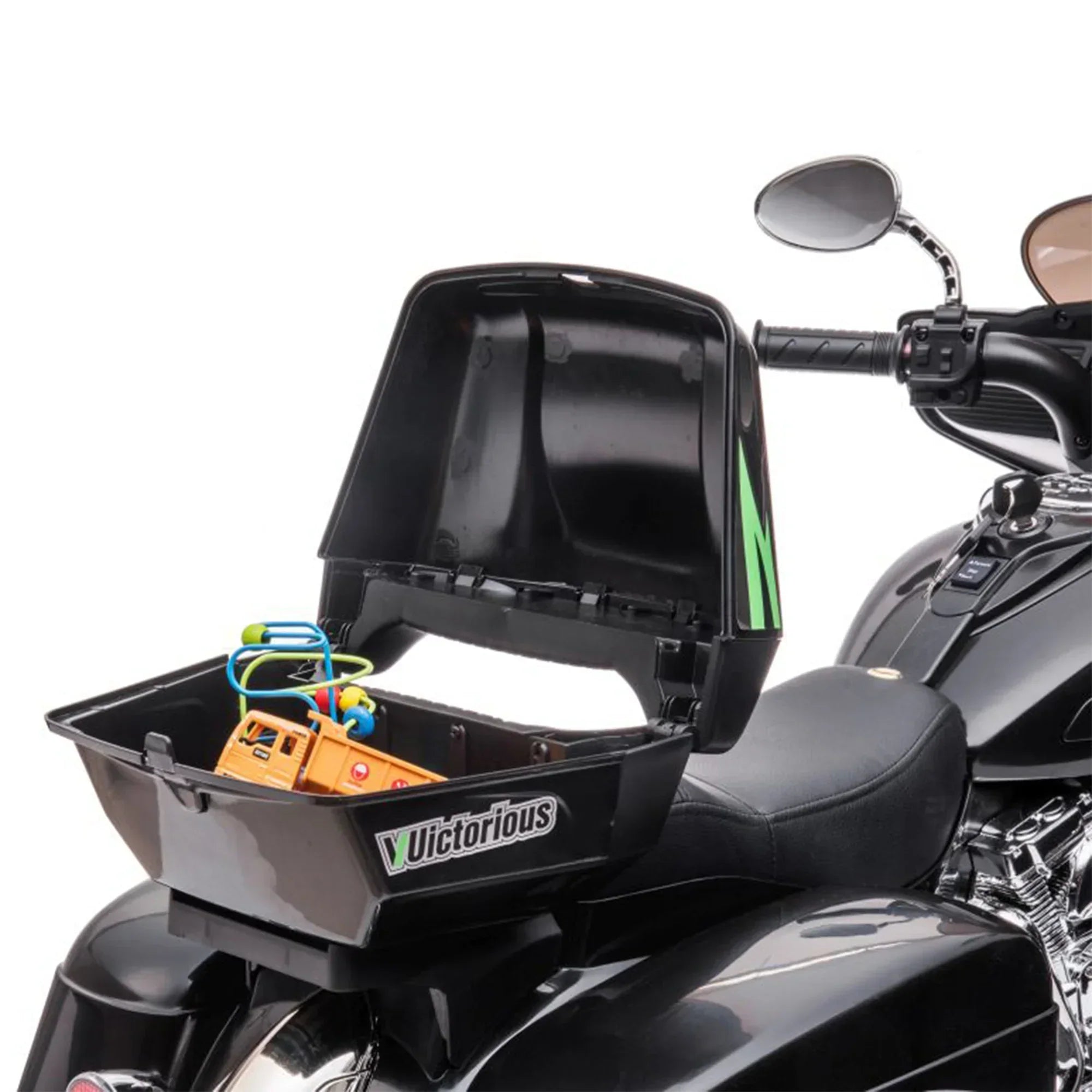 Black kids ride-on three-wheeled motorcycle with open rear storage box containing toys