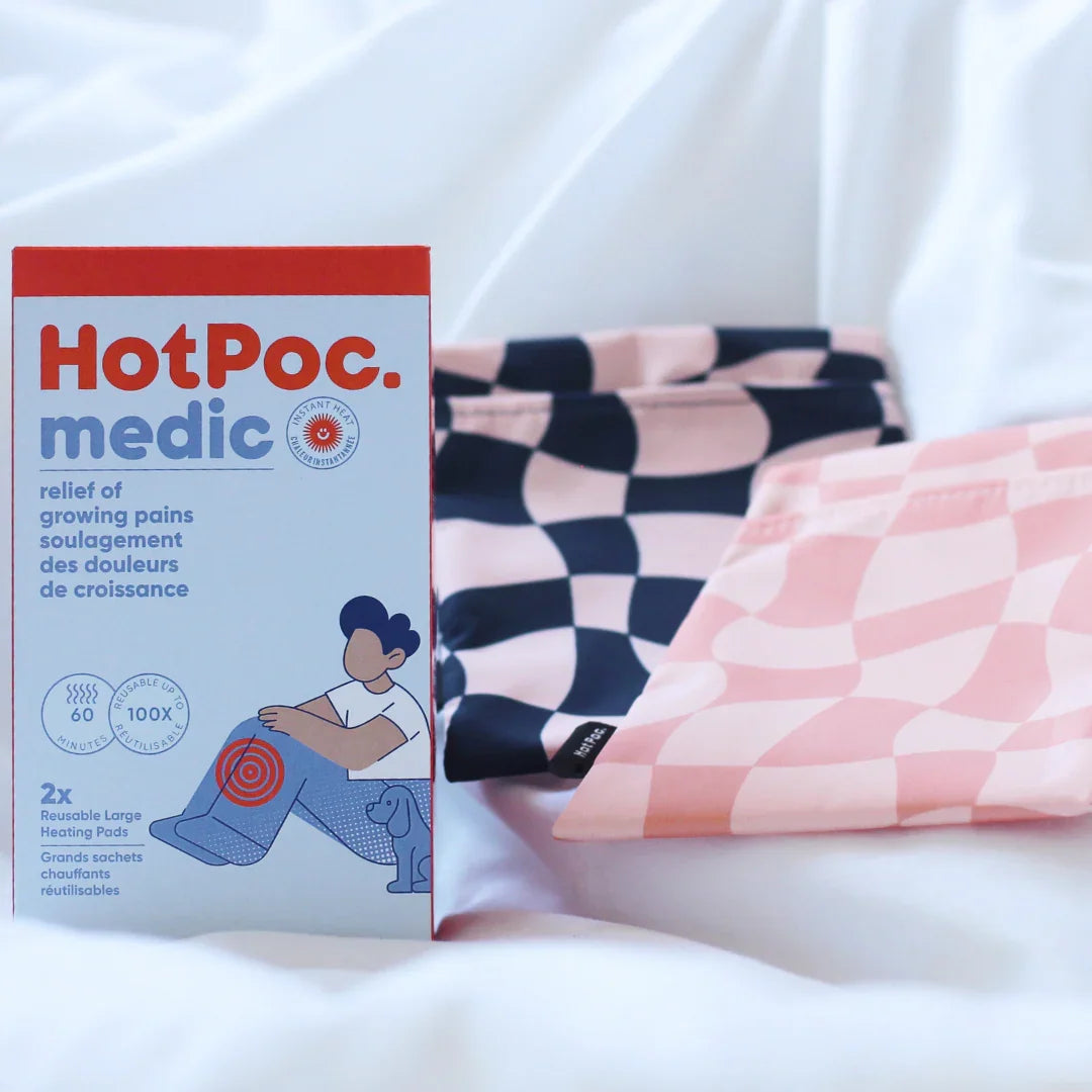 HotPoc medic reusable heating pads box with pink and blue checkered pads on a white background.
