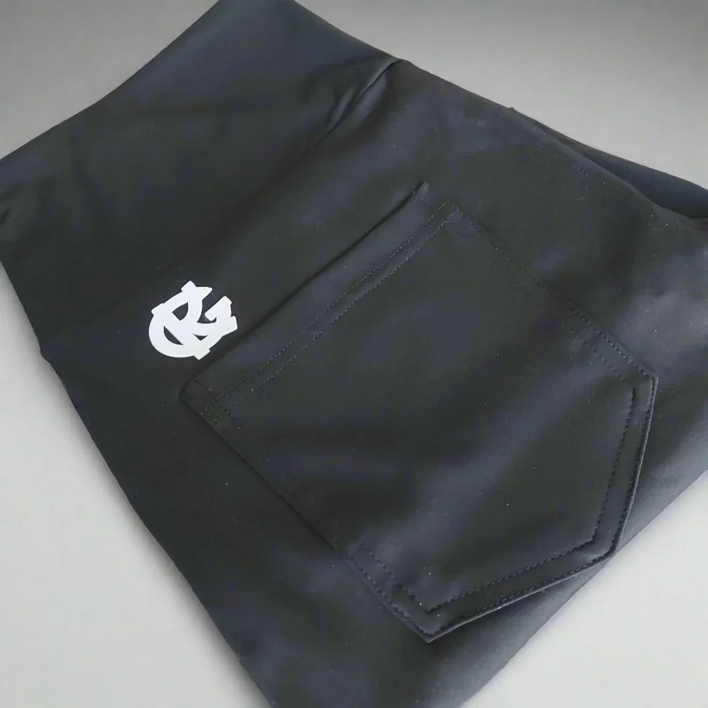 Black outdoor pants with rear pocket and white logo, camping and hunting apparel