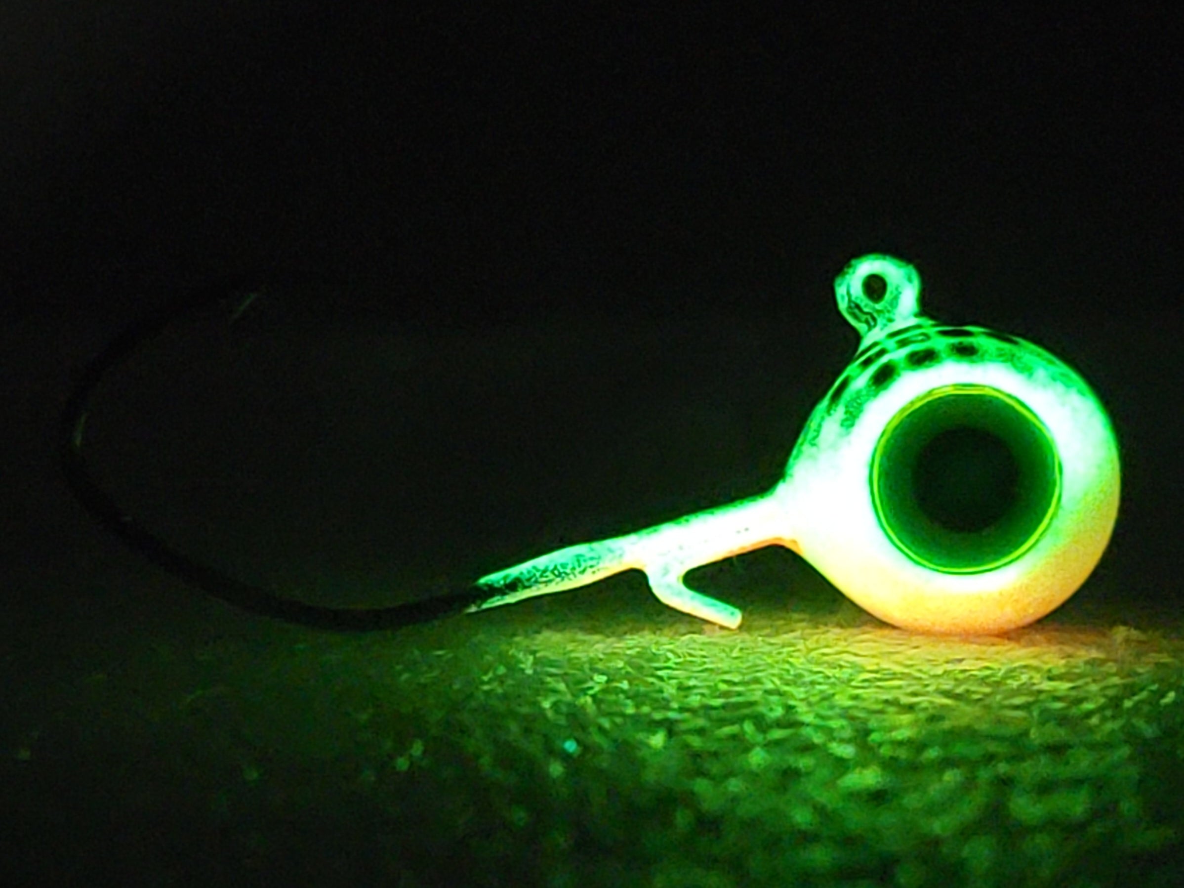 Glow in the dark fishing jig for night fishing, camping, or outdoor gear.