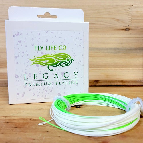 Fly fishing line in green and white with Fly Life Co LEGACY packaging on wooden surface