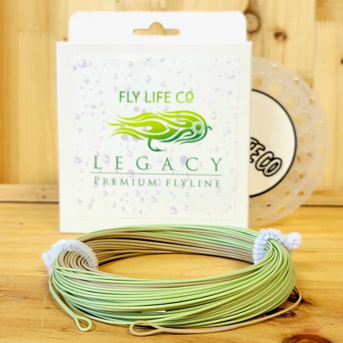 Fly fishing line coil with Legacy Premium Flyline packaging on wooden surface