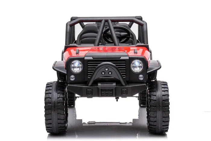 Red kids’ ride-on toy jeep with rugged tires and roll cage, front view, on white background.