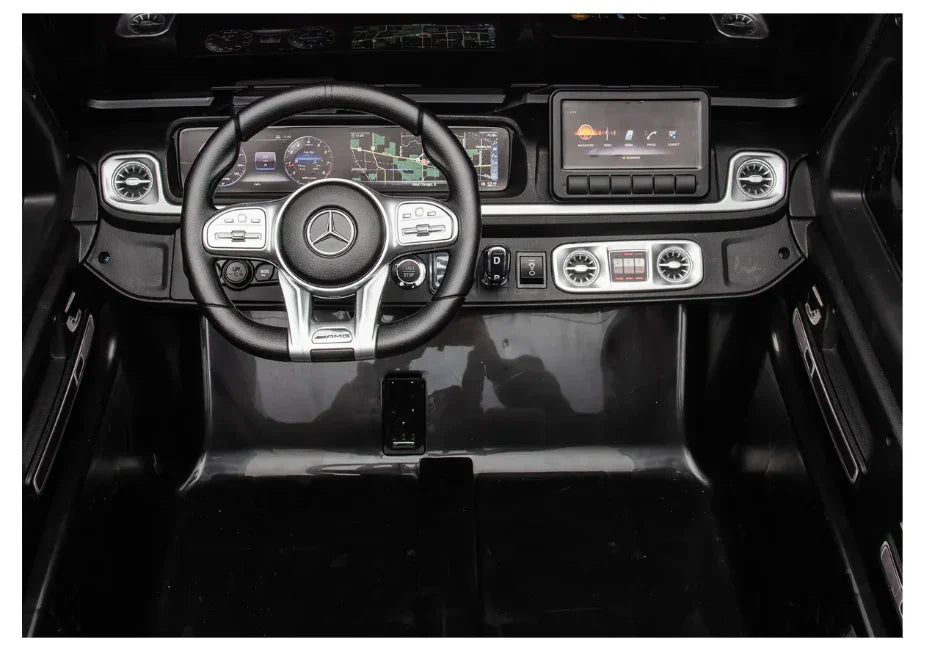 Mercedes-Benz G-Class dashboard with digital display, touch screen, and AMG steering wheel
