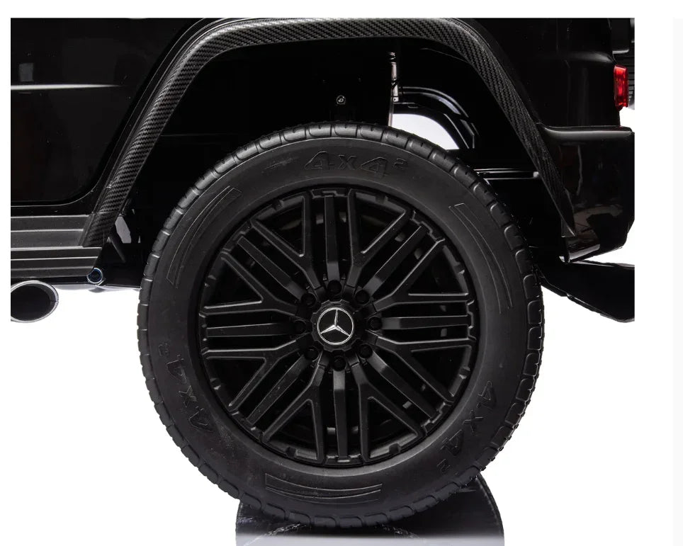 Black Mercedes SUV wheel and tire close-up with 4x4 branding