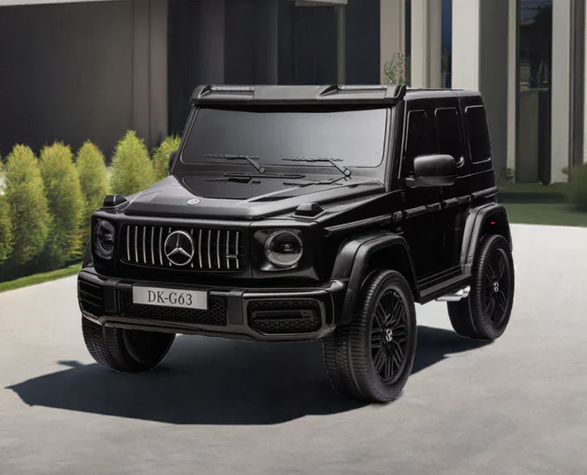 Black Mercedes G-Class DK-G63 electric toy car parked outdoors
