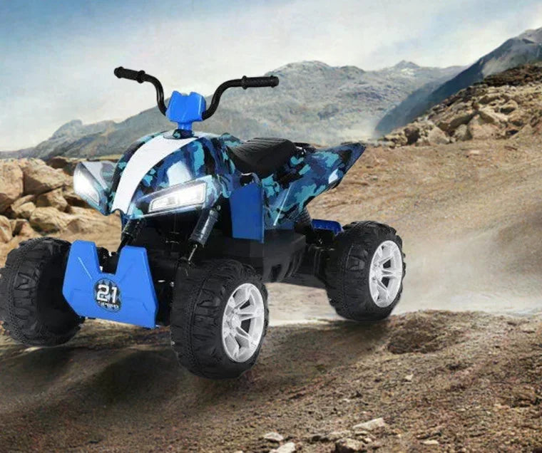Blue camouflage kids electric ATV with LED headlights on rocky desert terrain