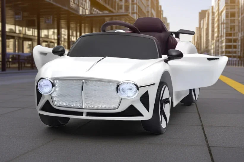 White toy electric car with open doors on urban street, modern kids ride-on vehicle