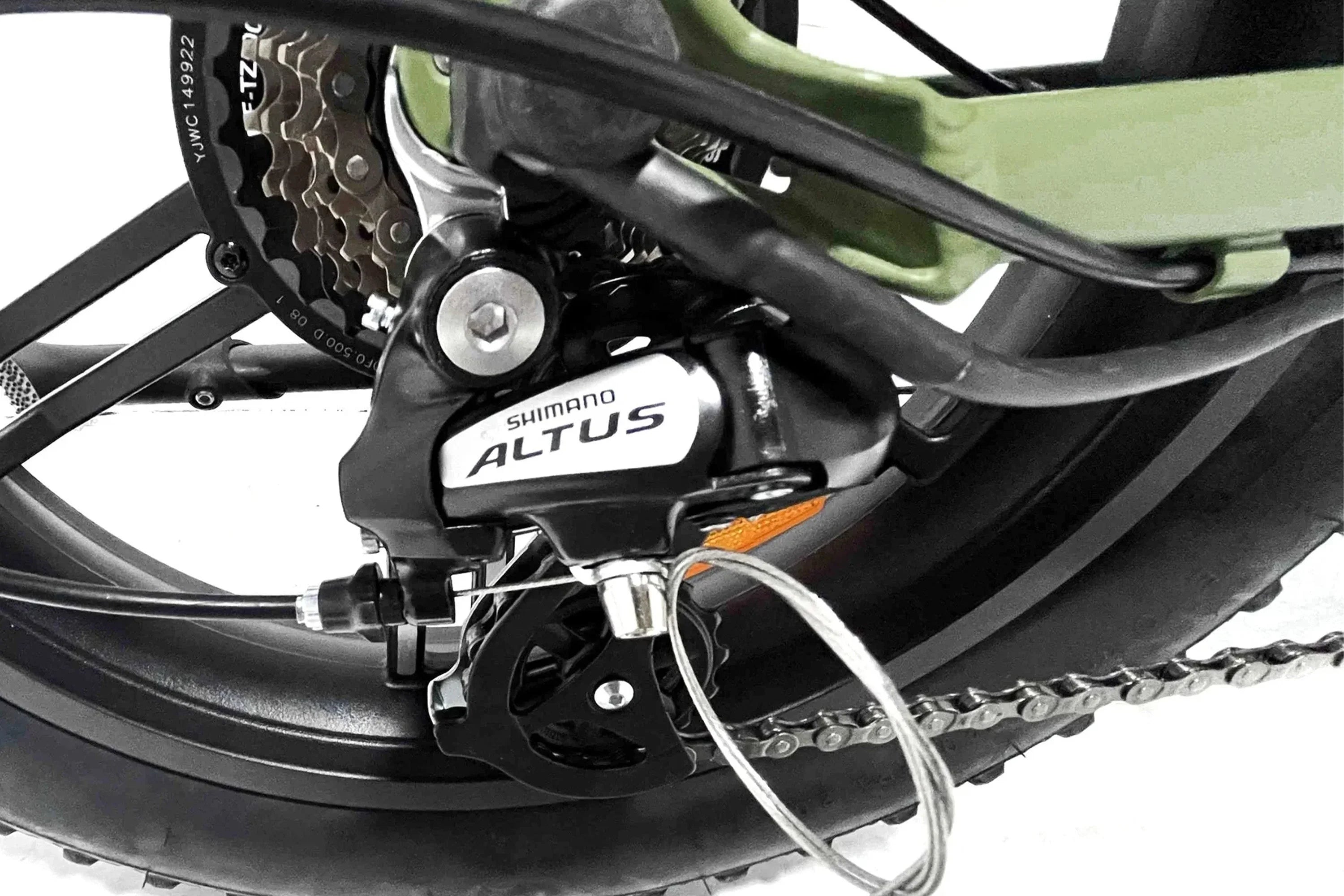 Close-up of Shimano Altus brakes on army green Taubik Aspect UL2849 certified e-bike wheel.
