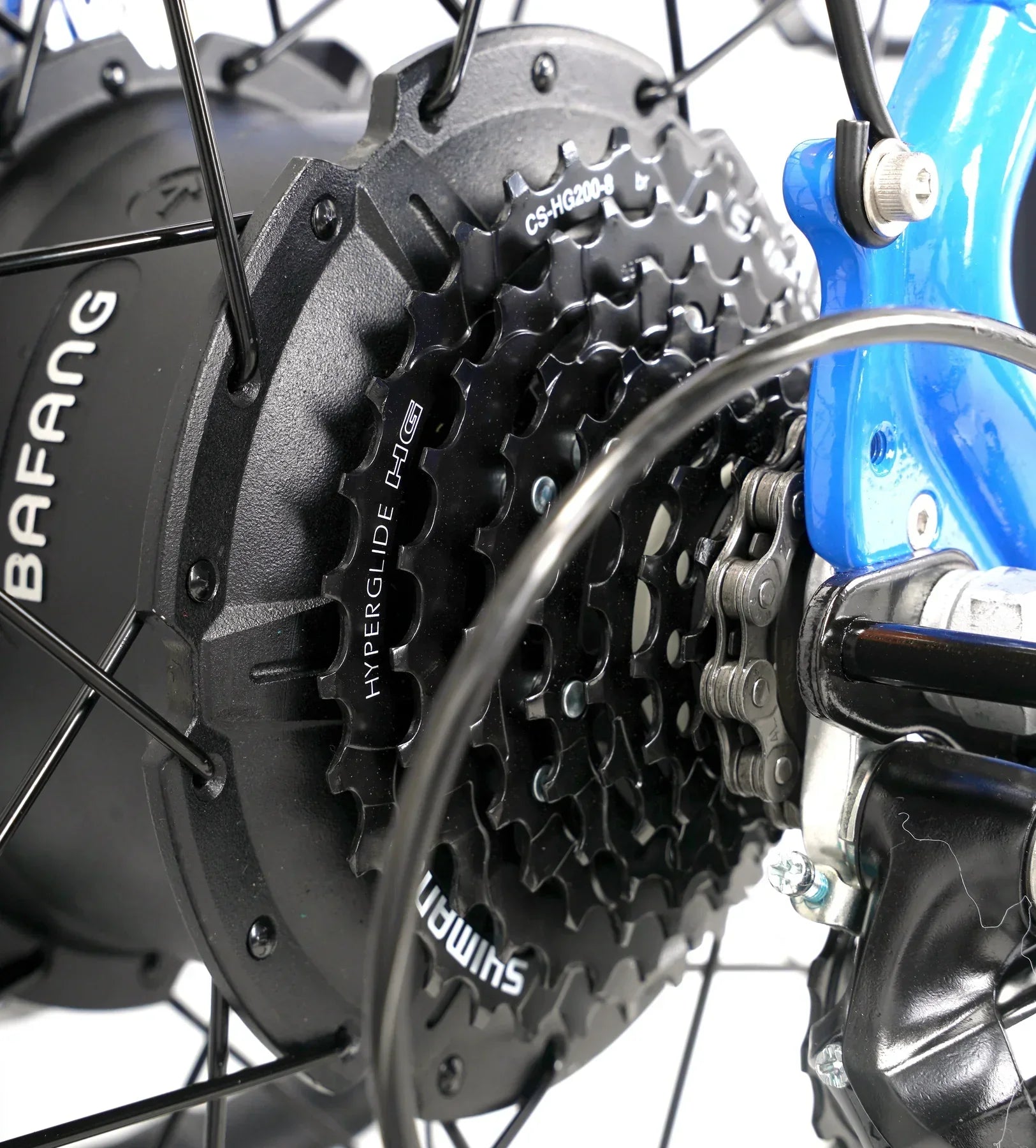 Close-up of Shimano Hyperglide gear cassette and Bafang motor on blue e-bike