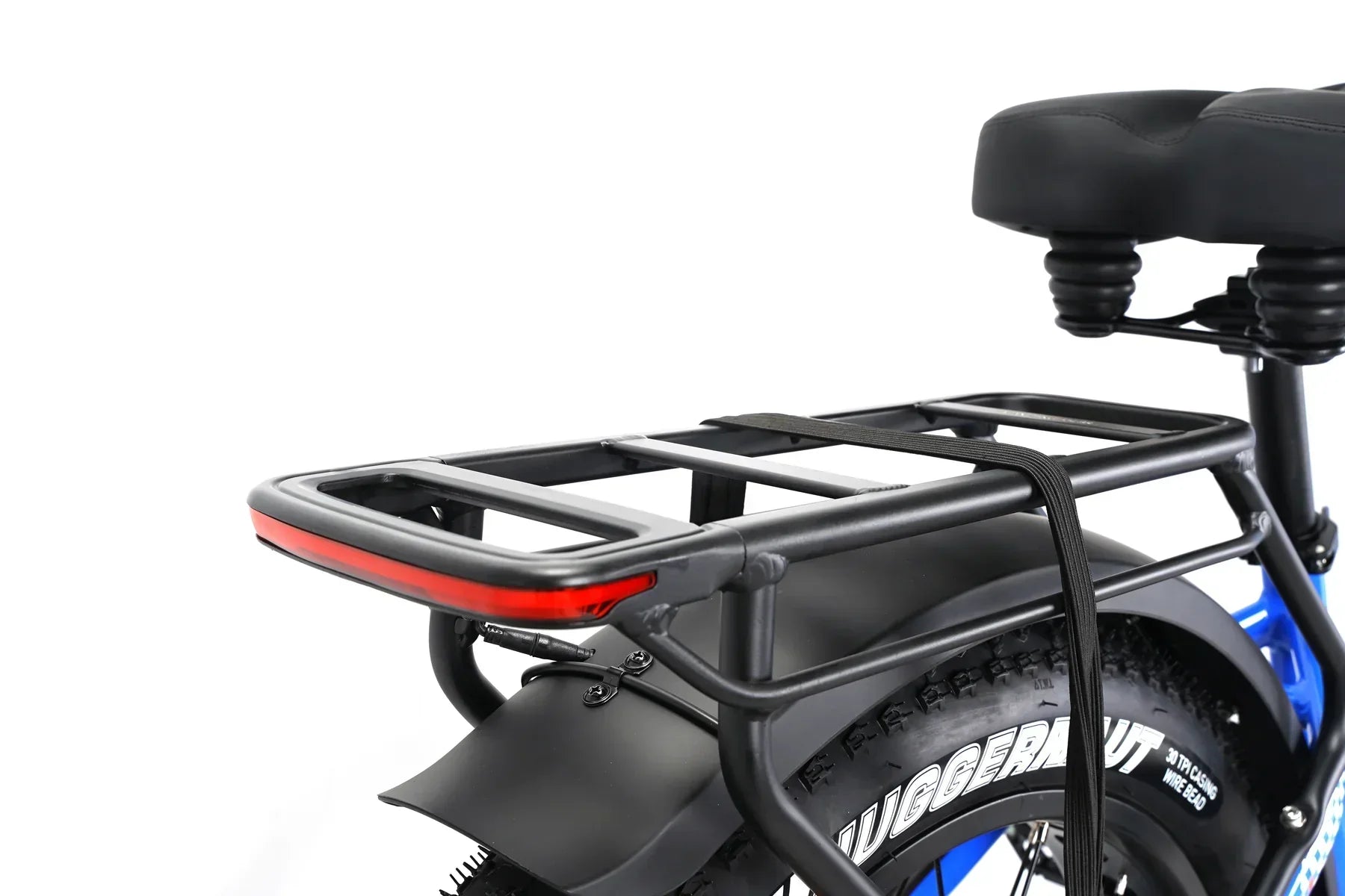 Close-up of Taubik Tour blue e-bike rear rack, seat, and fat tire