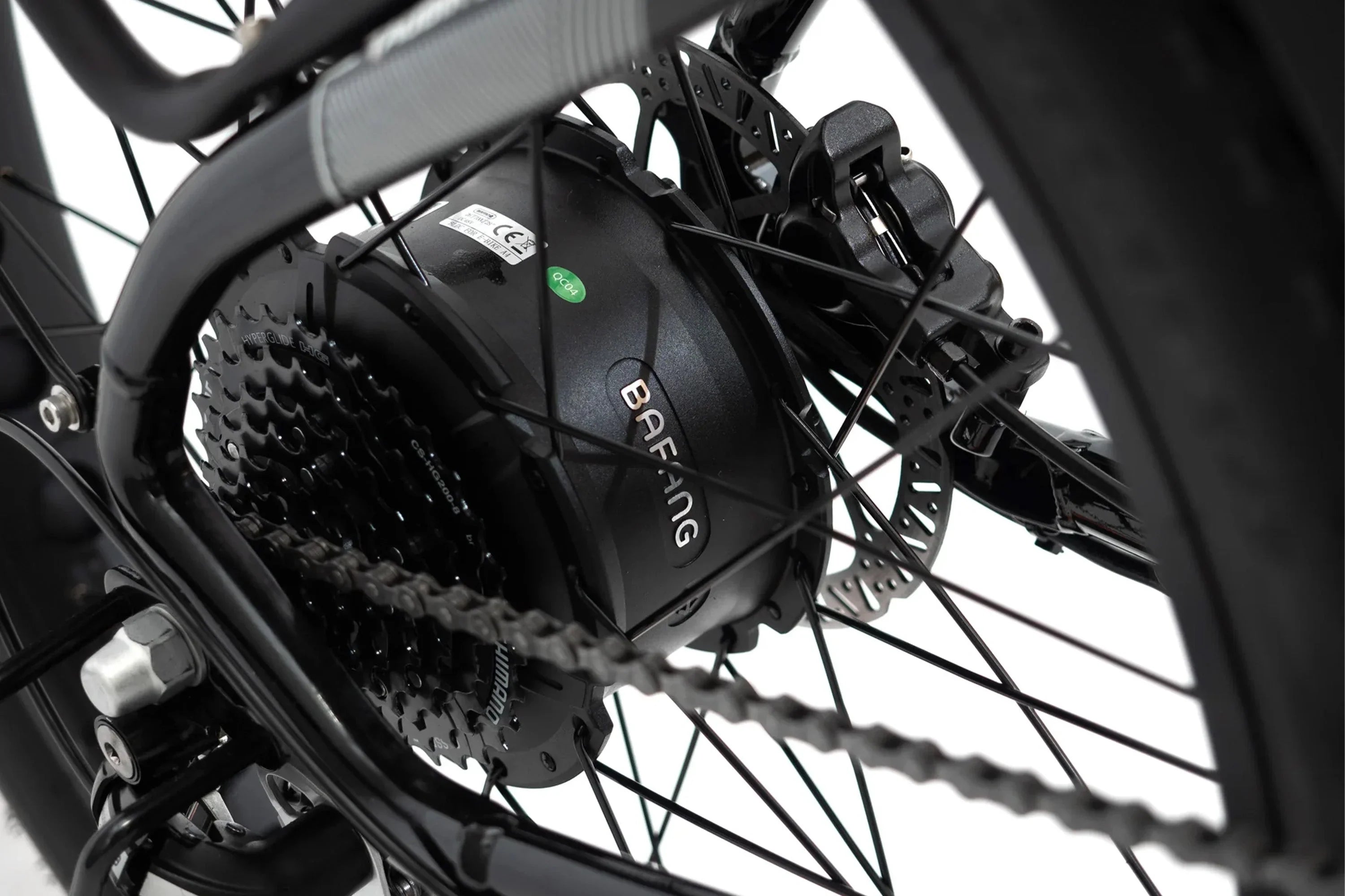 Close-up of Bafang motor, Shimano gear and disc brake on Taubik Westridge 4T e-bike wheel