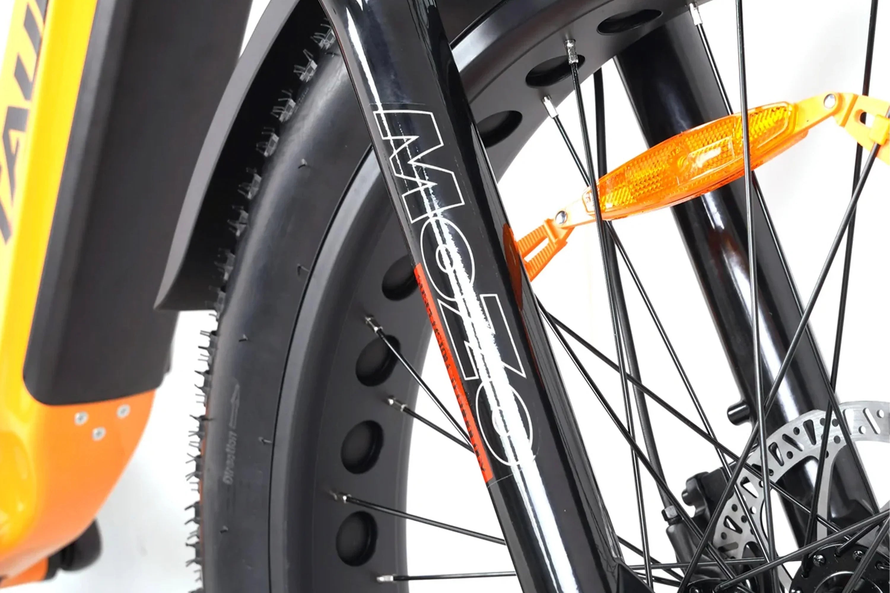Close-up of Taubik Westridge 4T off-road folding e-bike wheel, tire, and fork