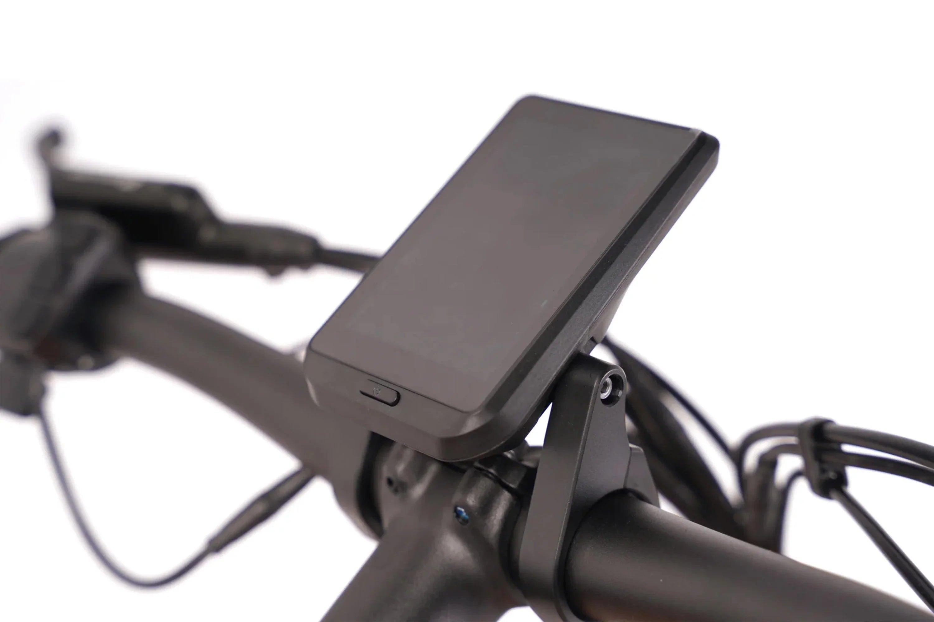 Close-up of e-bike LCD display mounted on black handlebar, off-road electric bike controls visible
