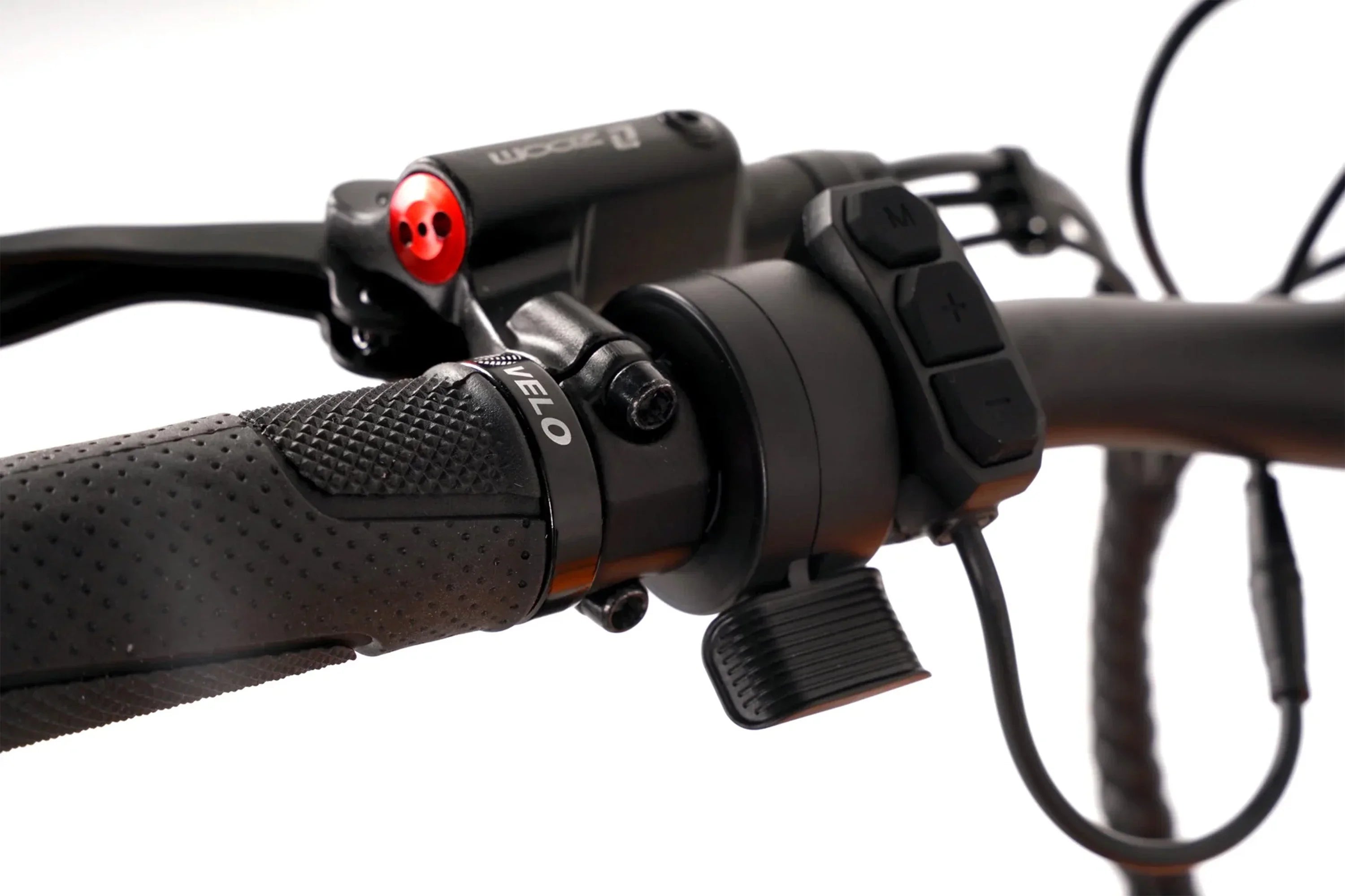Close-up of Taubik Westridge 4T off-road e-bike handlebar controls and textured grip