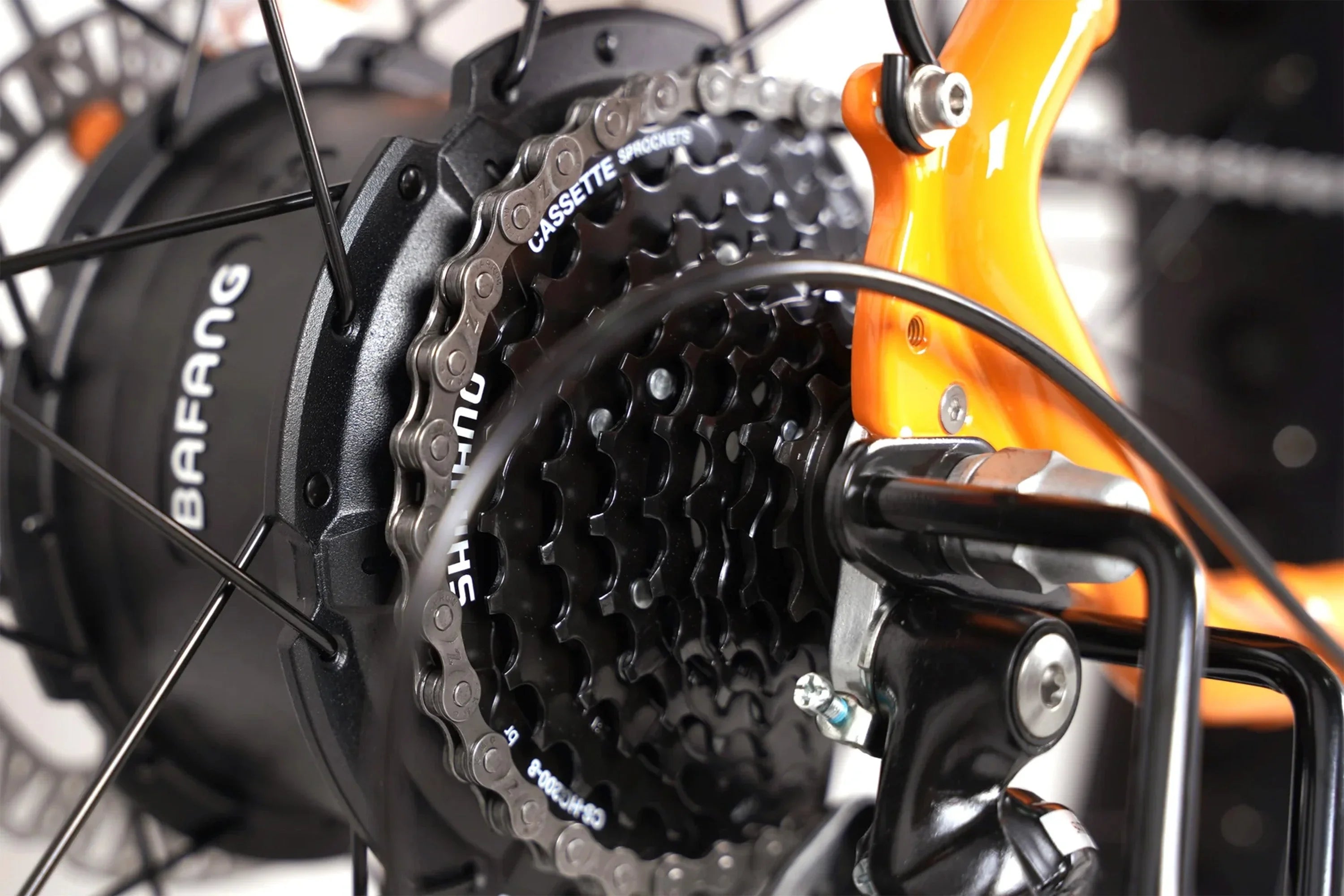 Close-up of Bafang motor and Shimano cassette on orange Taubik Westridge 4T off-road e-bike