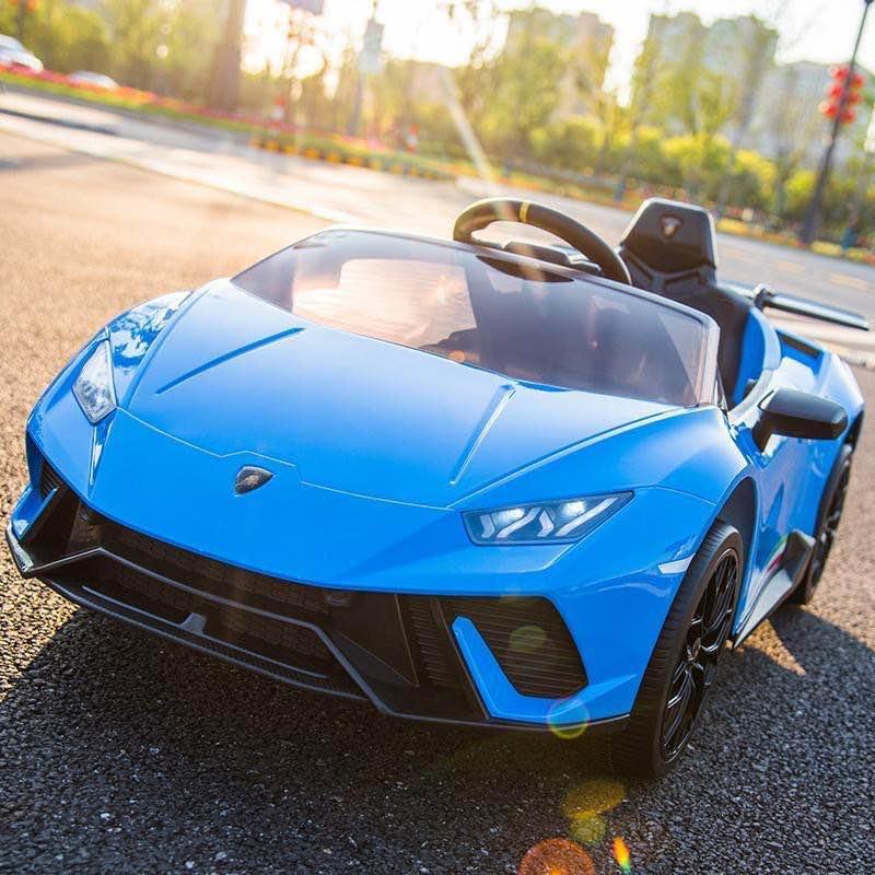 Blue Lamborghini kids ride on car toy outdoors on sunny day