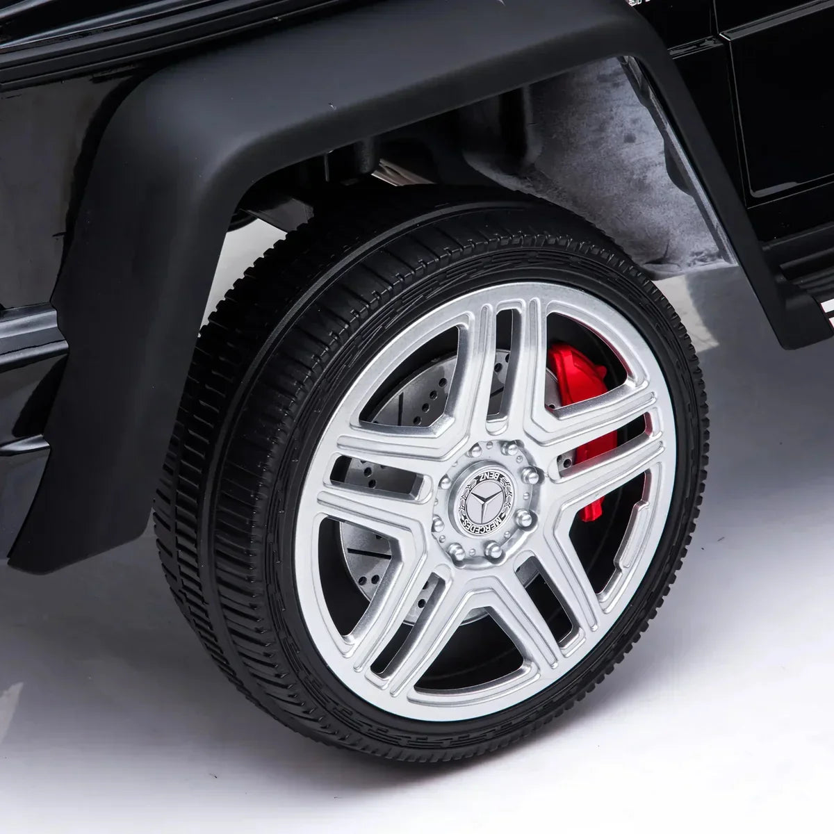 Close-up of silver Mercedes-Benz G-Wagon alloy wheel with red brake caliper