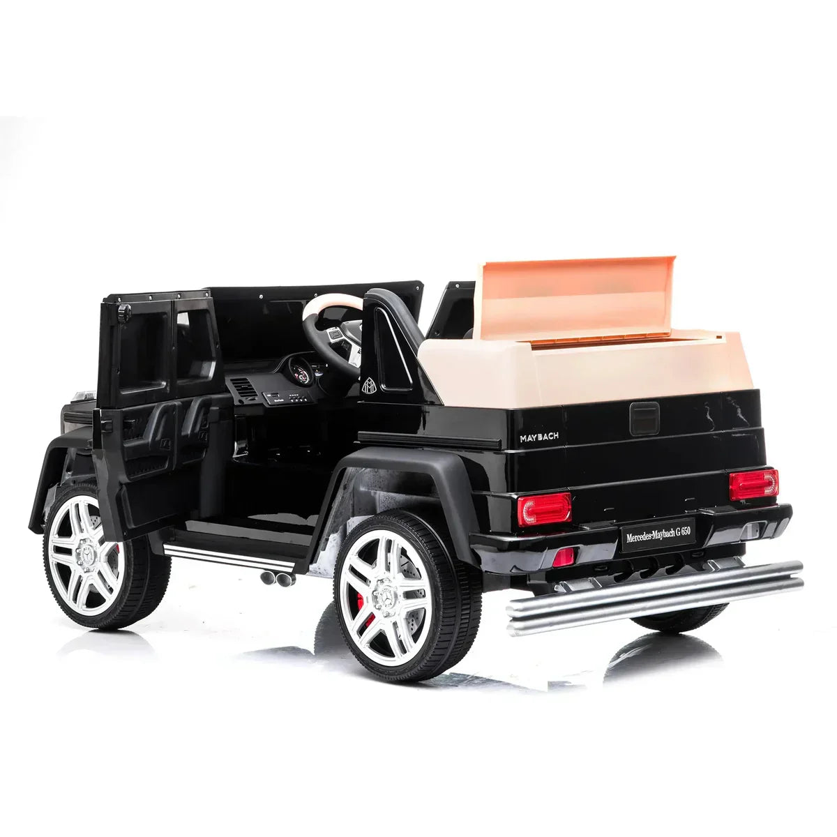 Black Mercedes-Maybach G650 kids ride-on car with open doors and beige seat on white background
