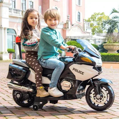 Two kids riding a white 24V police toy motorcycle outdoors, stylish and realistic design