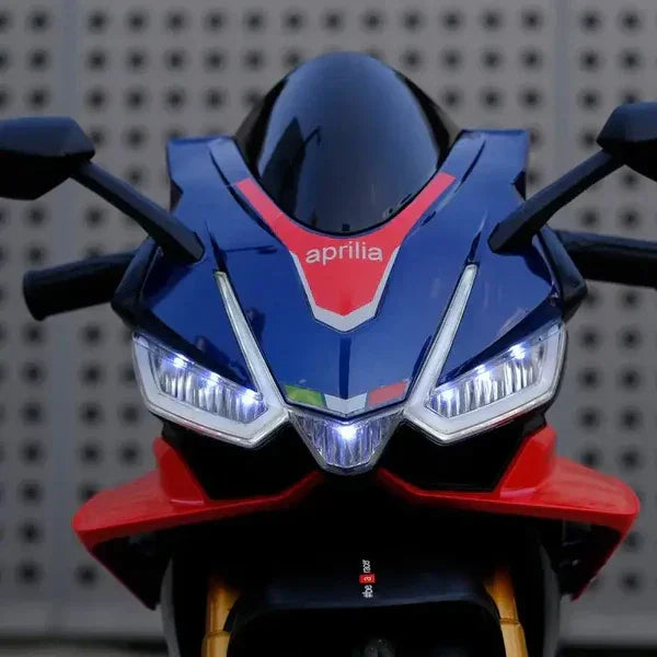 Blue Aprilia motorcycle front view with LED headlights and sporty fairing