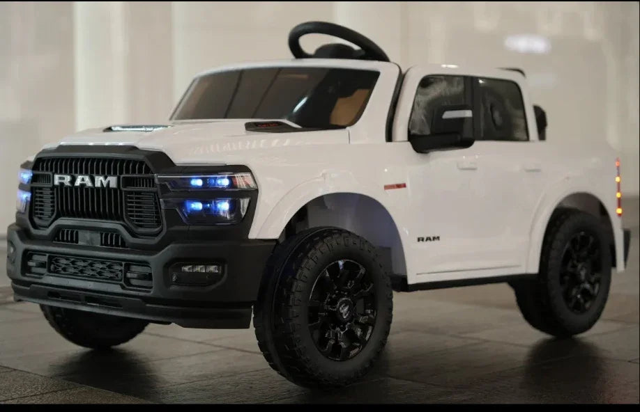 White RAM toy electric ride-on truck with LED headlights on a tiled floor