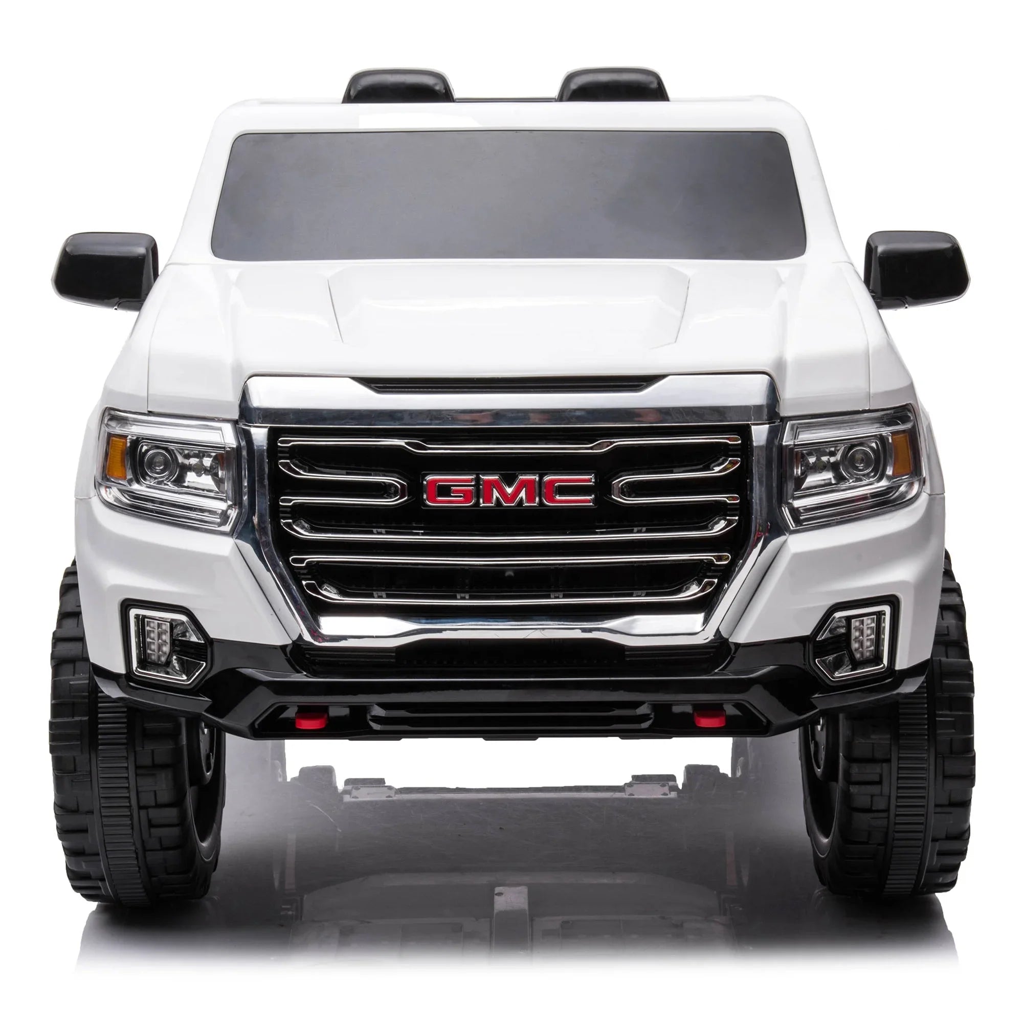 White GMC toy truck front view, bold grille, black accents, ride-on car for kids