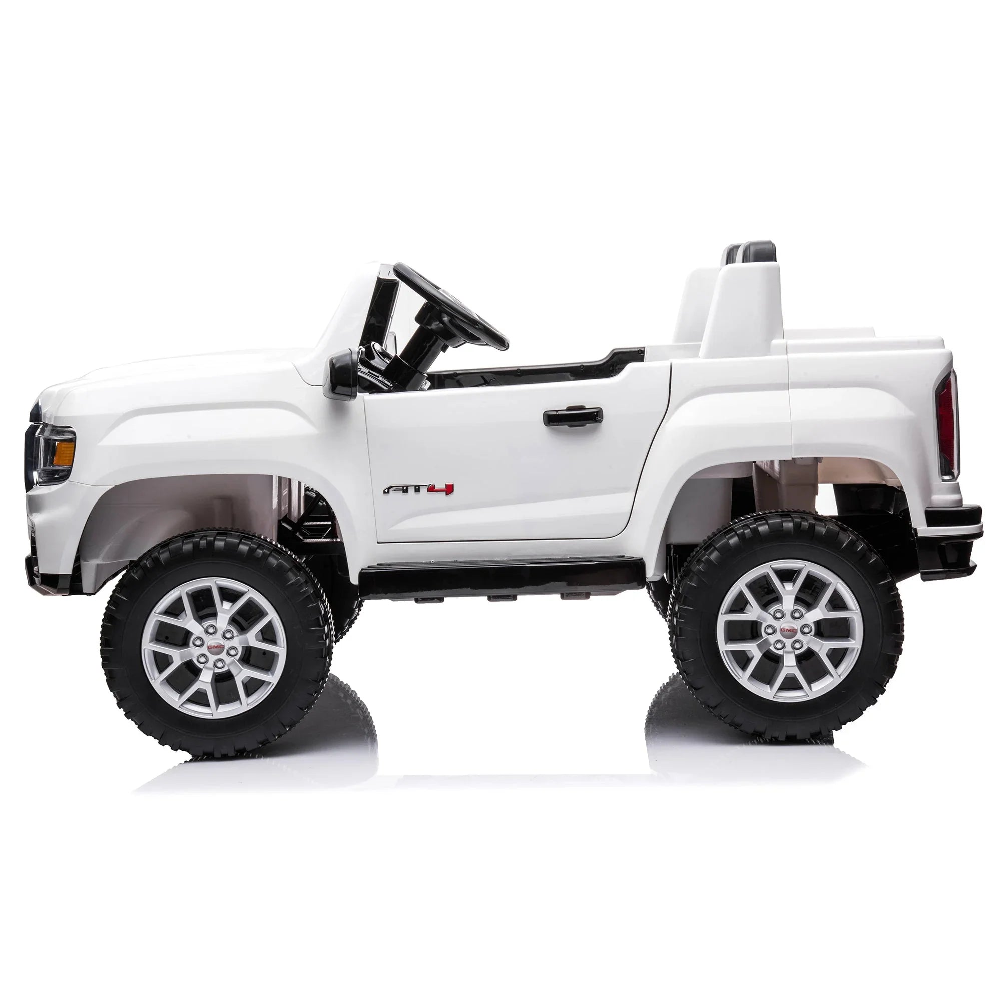 White ride-on toy truck for kids with large wheels and open top, side view