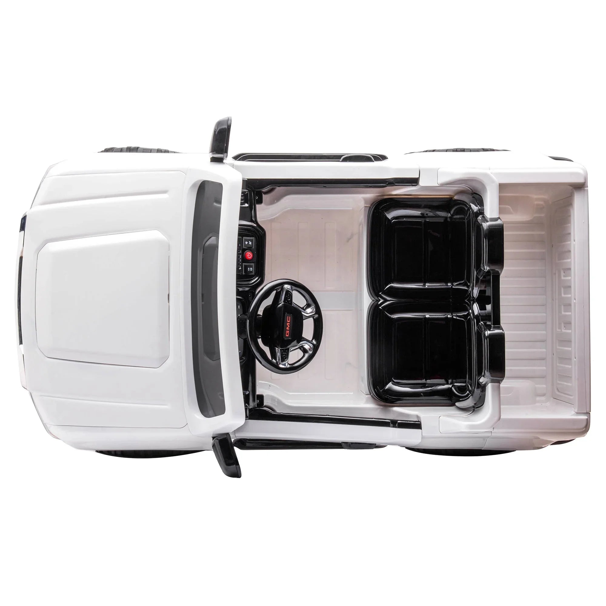 Top view of white GMC toy ride-on car with black seats and steering wheel