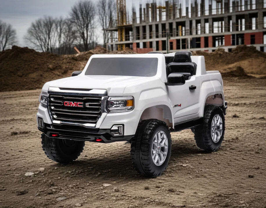 White GMC toy truck for kids on construction site background