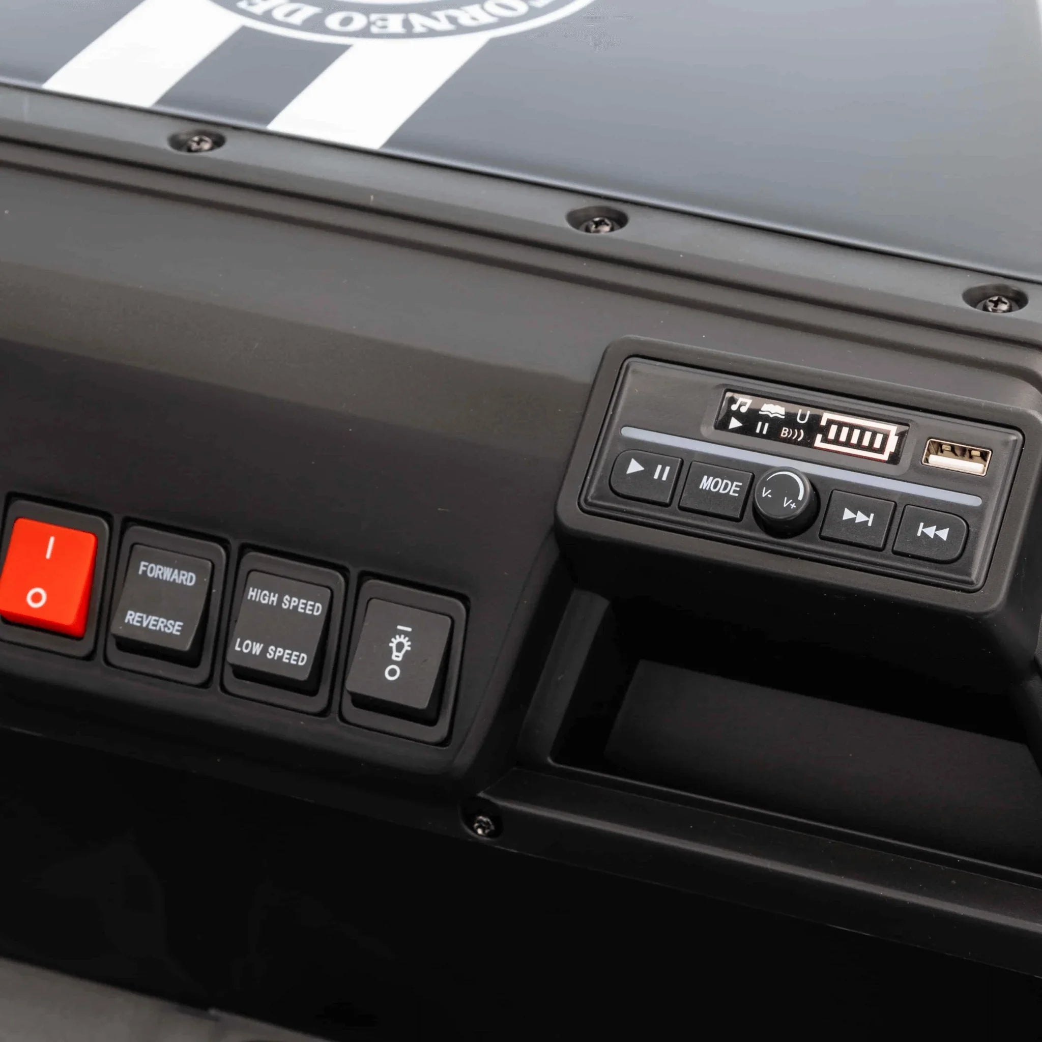 Dashboard controls of 4-seater 24V kids electric buggy with buttons and media panel
