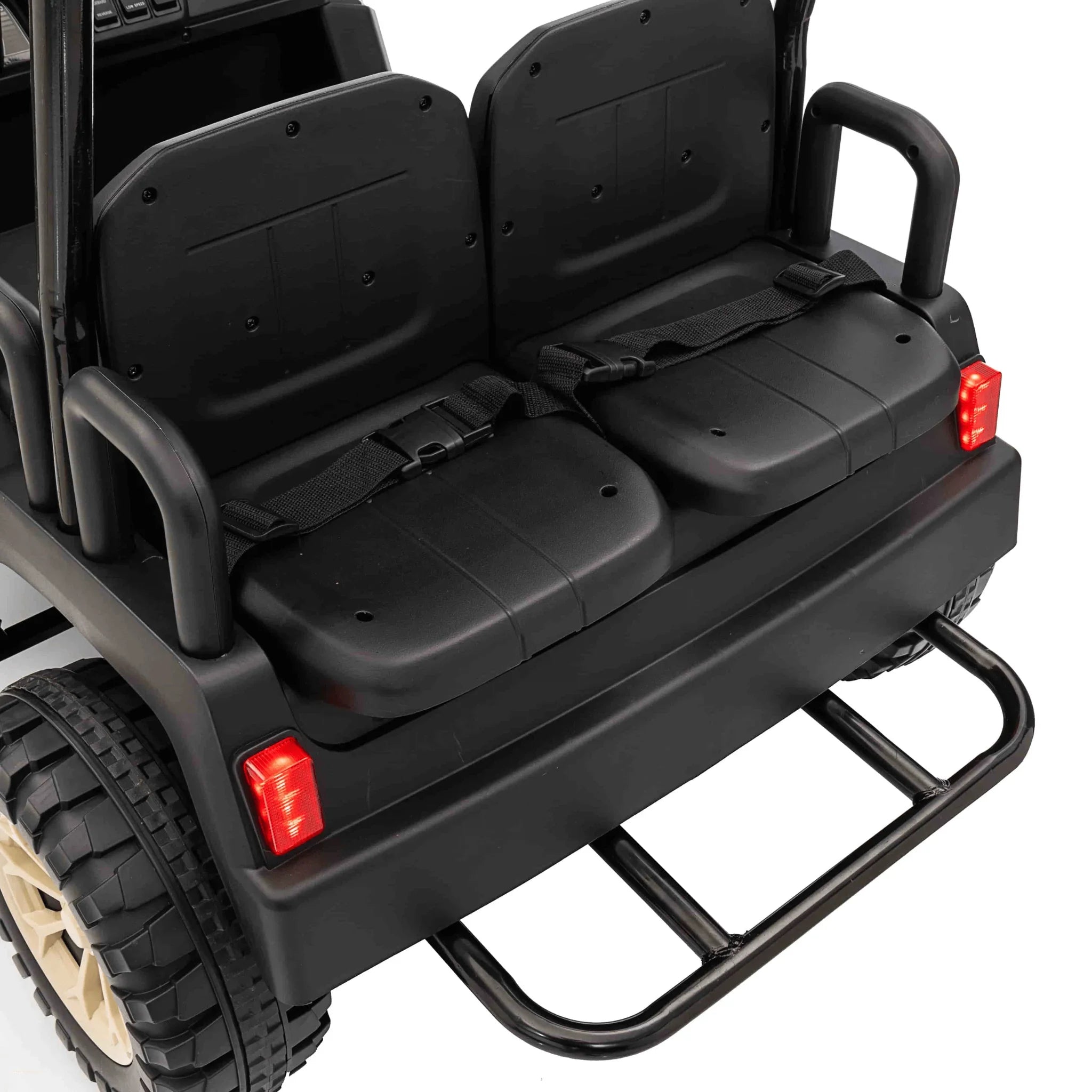 Close-up of 4-seat buggy rear seats with seat belts and black rubber wheels