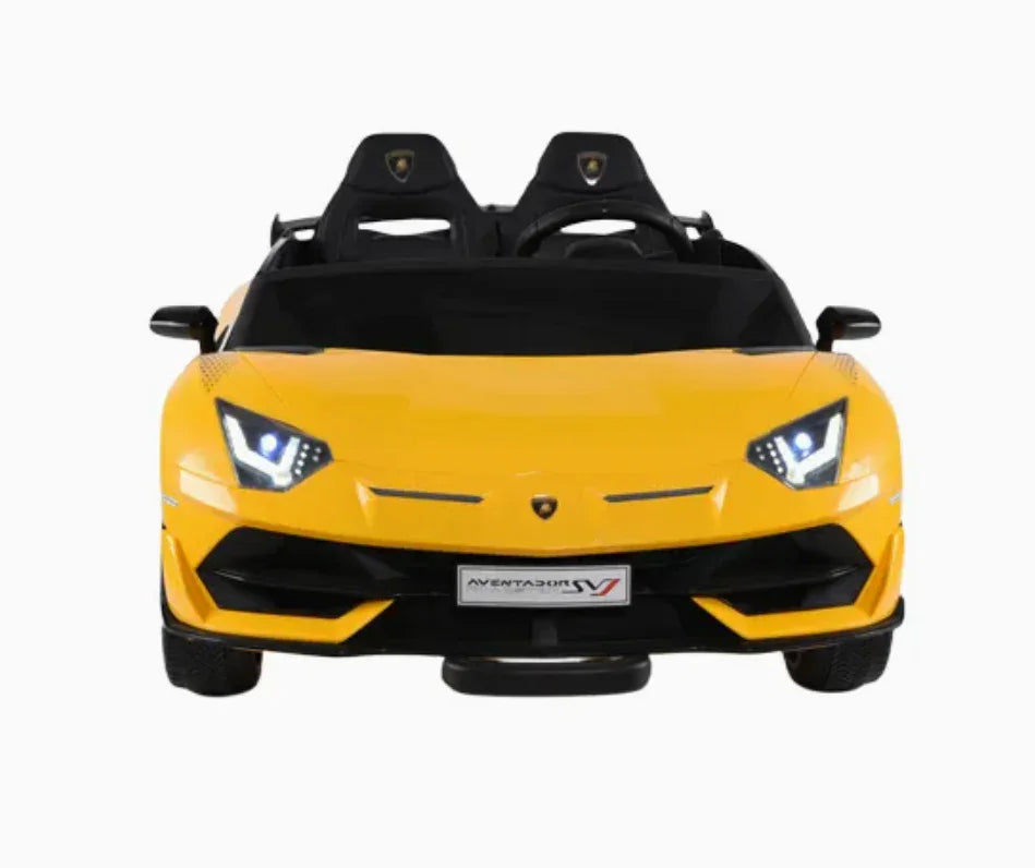 Yellow Lamborghini Aventador SV kids ride-on car with LED headlights, front view